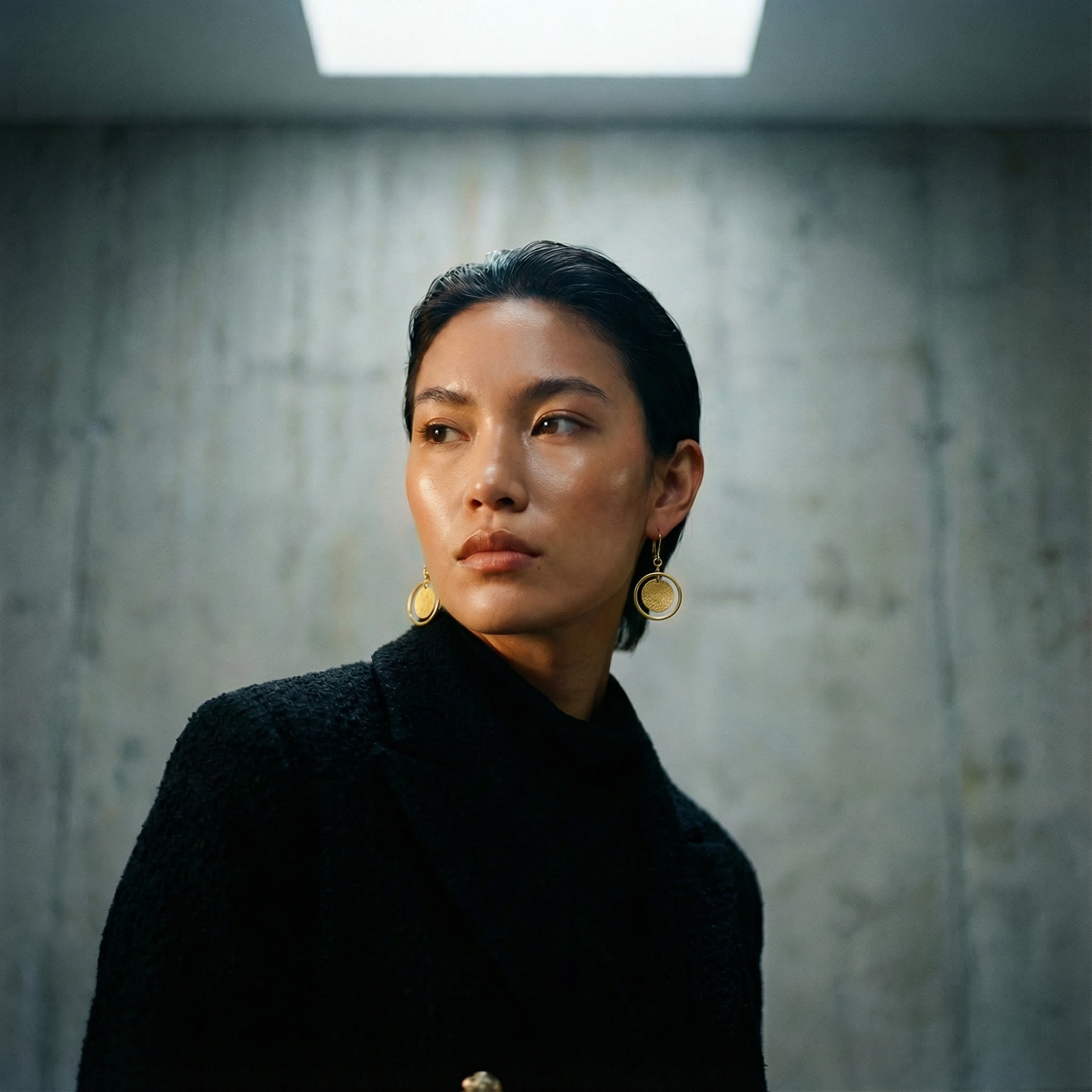 Large gold stainless steel halo earrings with a 30 mm polished ring and a suspended textured gold disc, high-shine finish — Lawless Jewellery