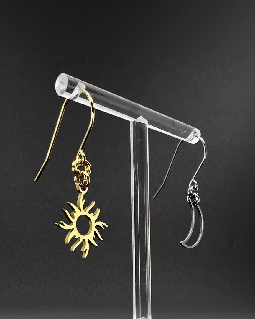 Mixed metal sun and moon earrings with silver crescent moon and gold sun charms on stainless steel hooks, Eos Dawn Earrings by Lawless Jewellery.