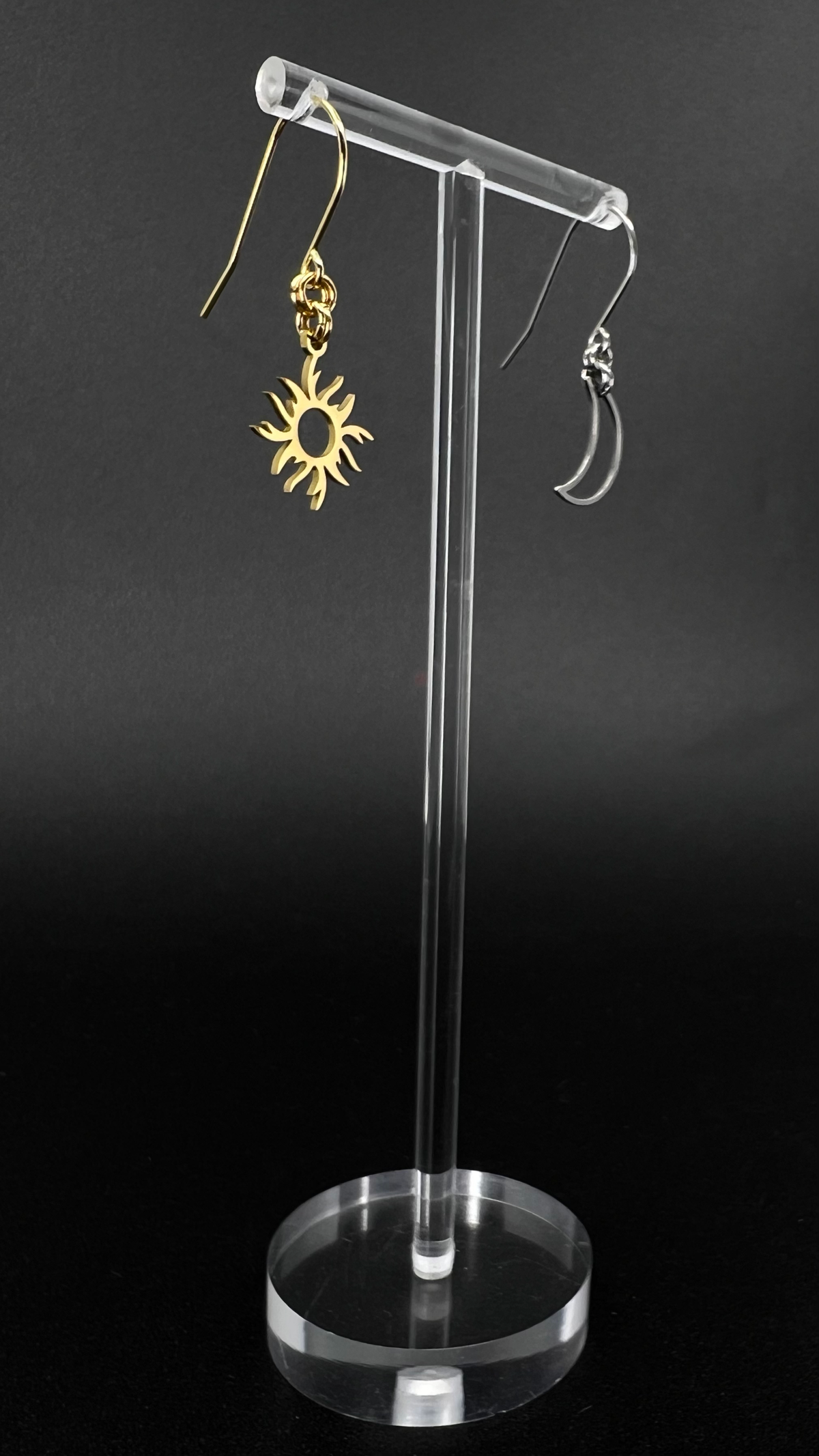 Mixed metal sun and moon earrings with silver crescent moon and gold sun charms on stainless steel hooks, Eos Dawn Earrings by Lawless Jewellery.