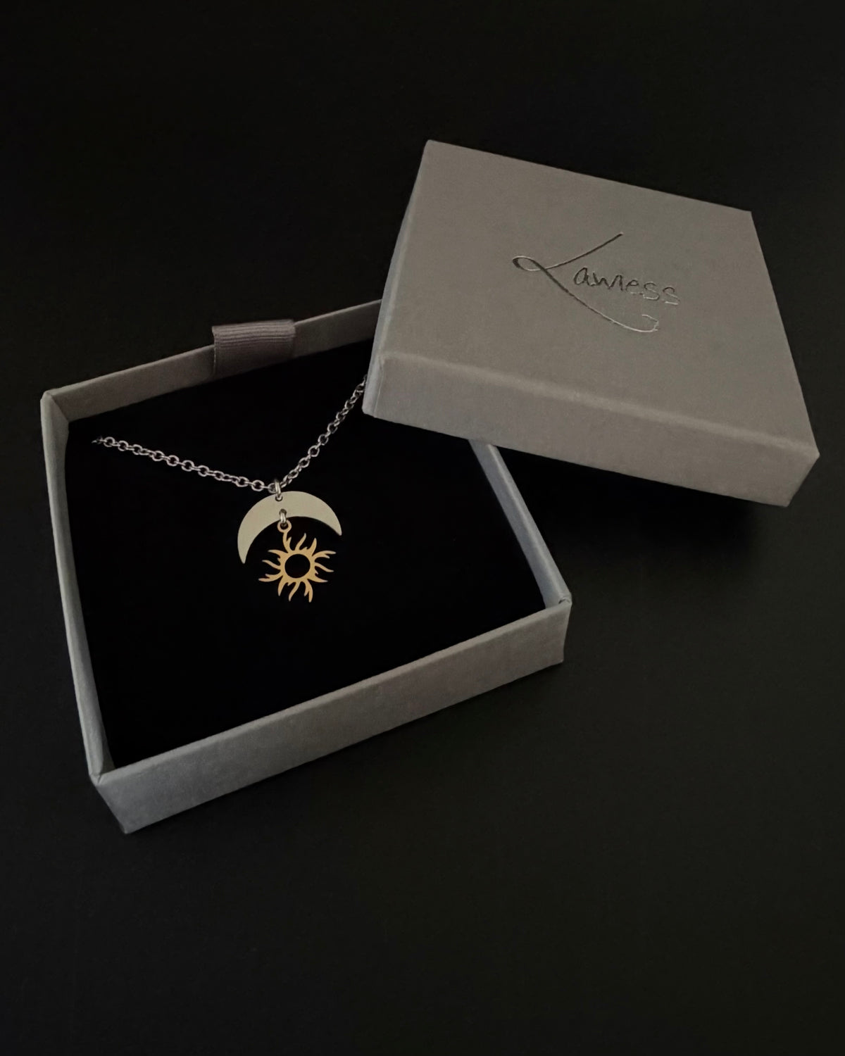 Gold plated and silver stainless steel sun and moon pendant necklace on medium weight chain, adjustable 46cm or 51cm, Lawless Jewellery.