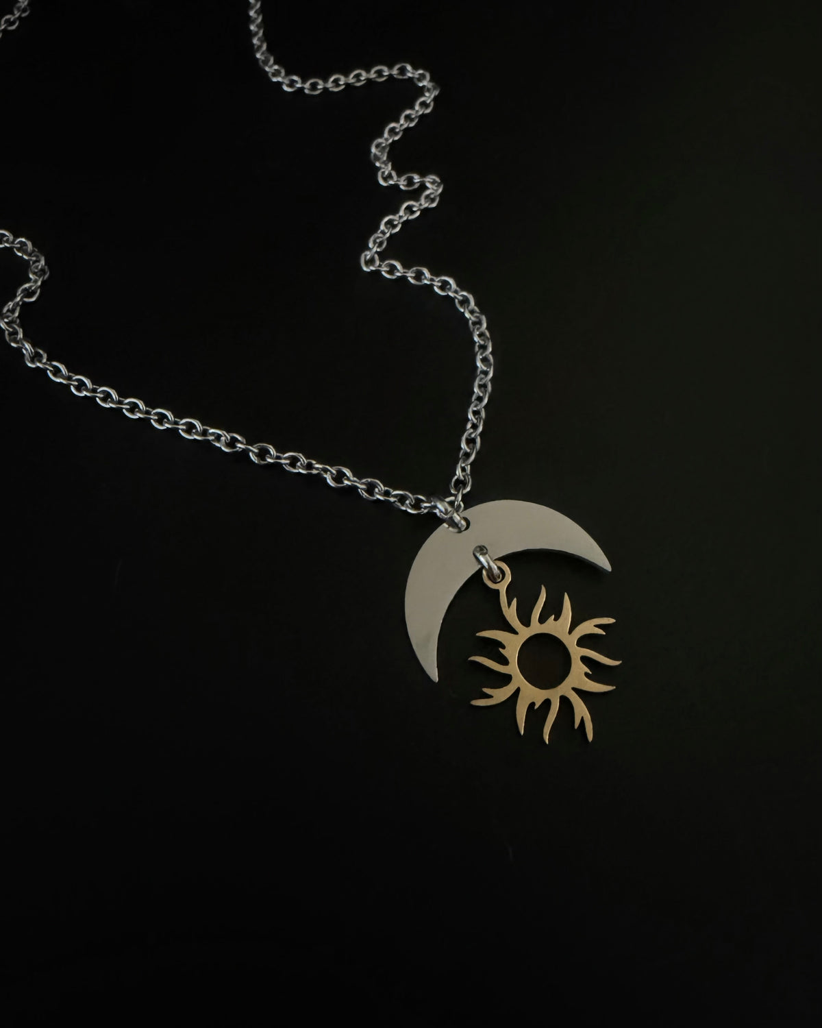Gold plated and silver stainless steel sun and moon pendant necklace on medium weight chain, adjustable 46cm or 51cm, Lawless Jewellery.