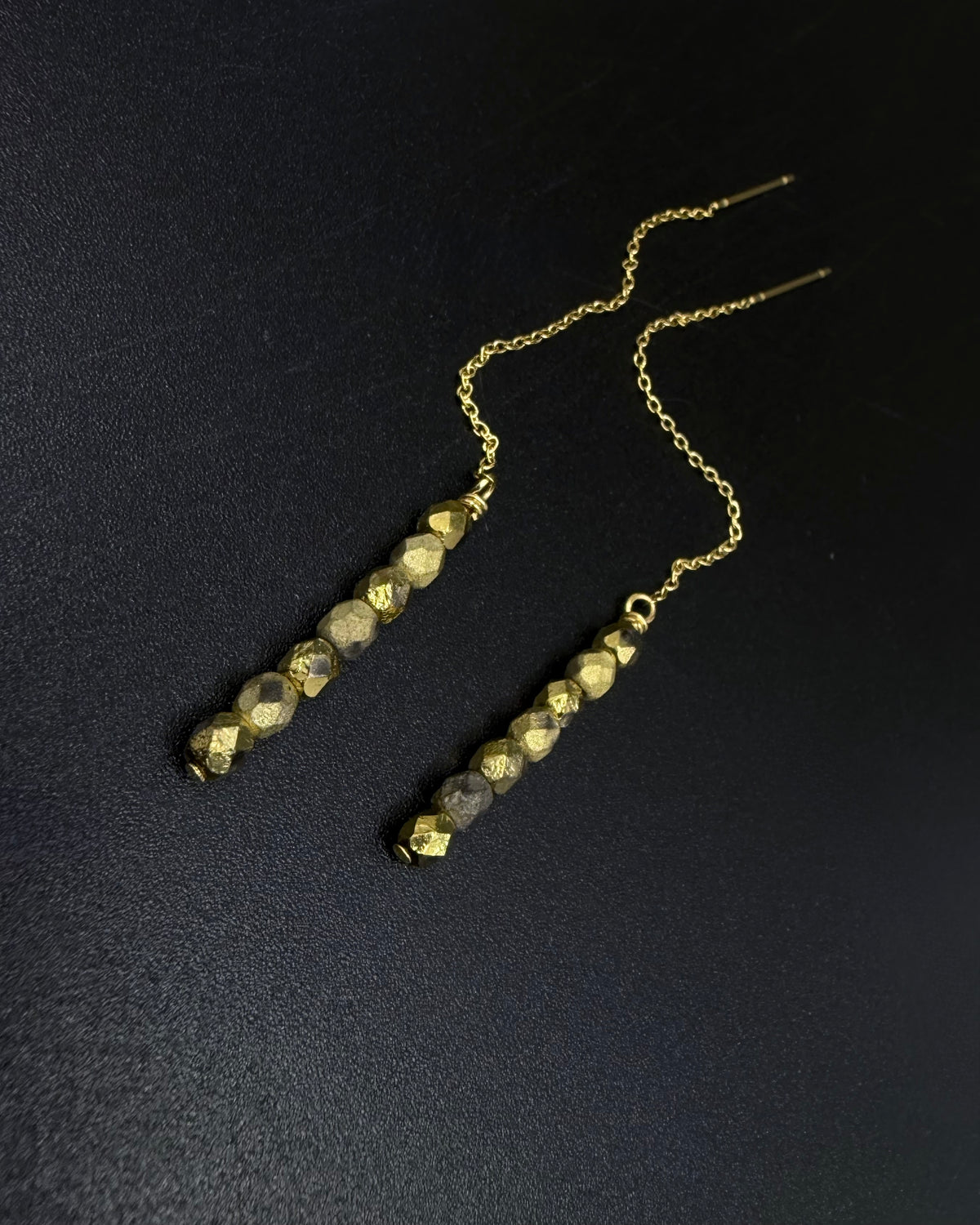 Gold ear thread earrings with fire-polished crystal drops and adjustable length, Eos Collection by Lawless Jewellery.
