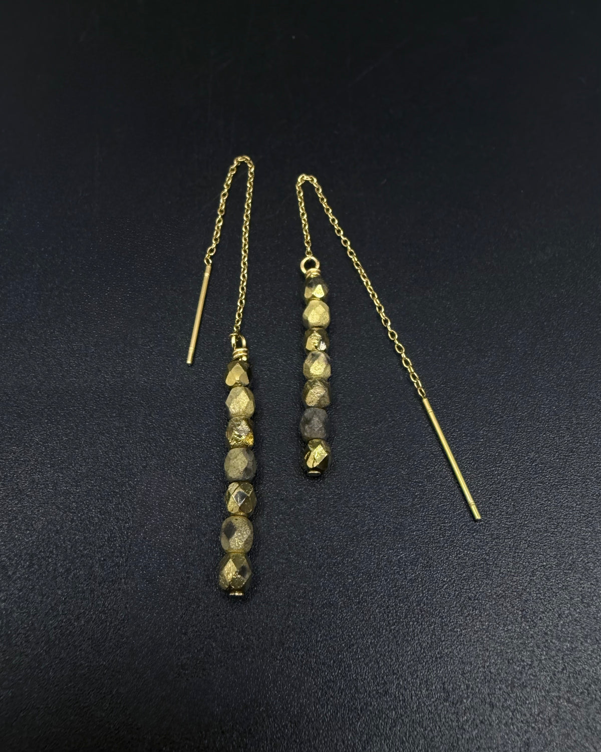 Gold ear threader earrings with fire-polished crystal drops and adjustable length, Eos Collection by Lawless Jewellery.