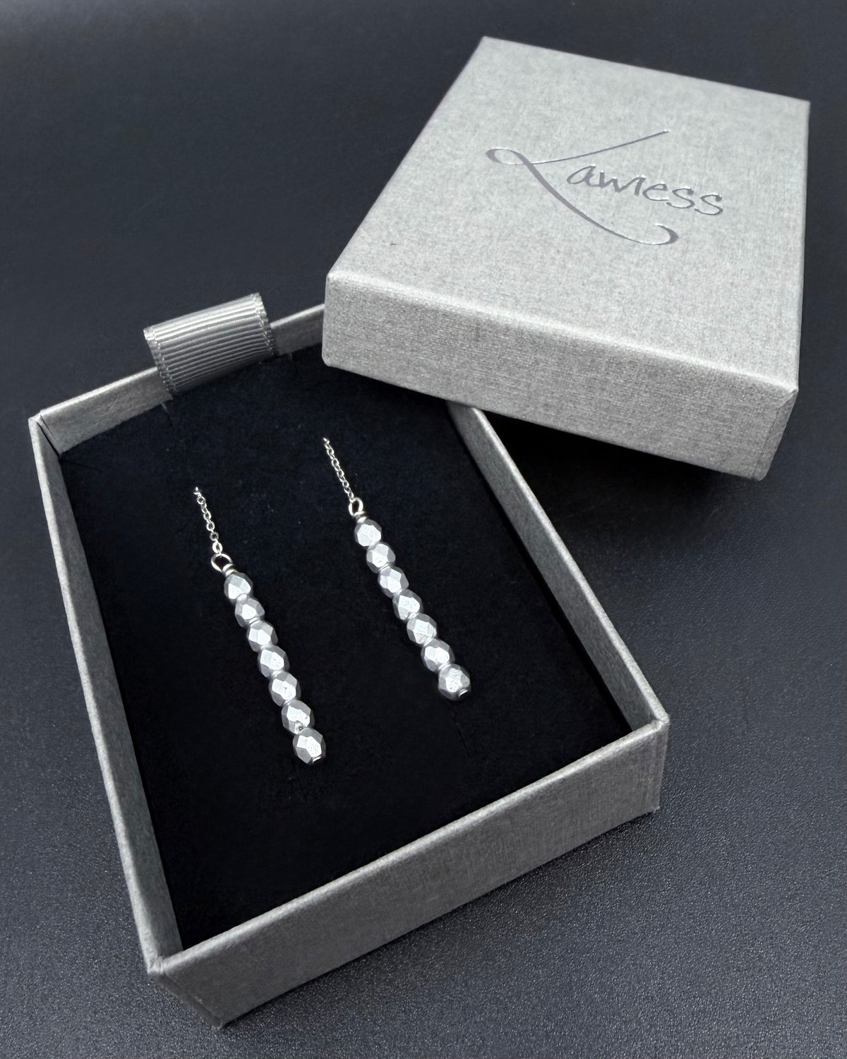 Silver Eos ear threader earrings with fire-polished crystal drops, minimalist celestial threader design in stainless steel