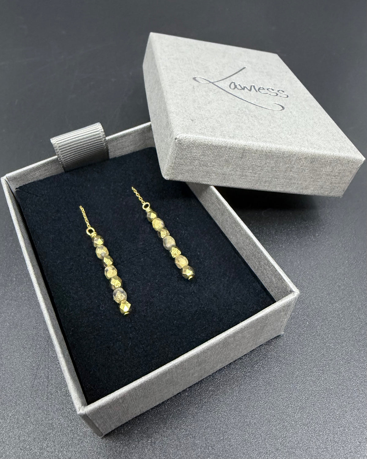 Gold ear threader earrings with fire-polished crystal drops and adjustable length, Eos Collection by Lawless Jewellery.