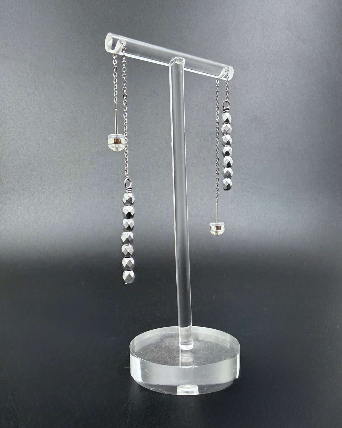 Silver Eos ear threader earrings with fire-polished crystal drops, minimalist celestial threader design in stainless steel