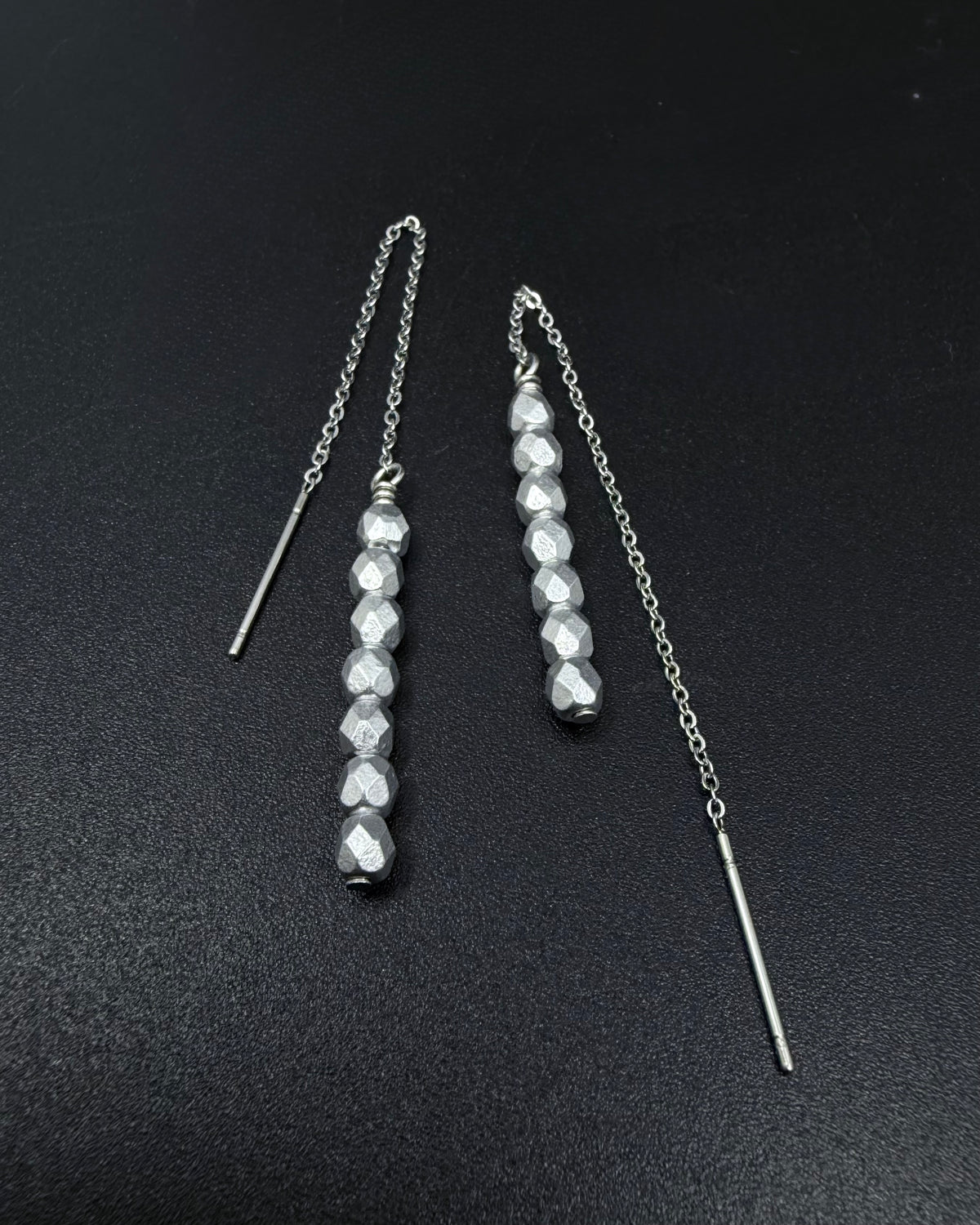 Silver Eos ear threader earrings with fire-polished crystal drops, minimalist celestial threader design in stainless steel