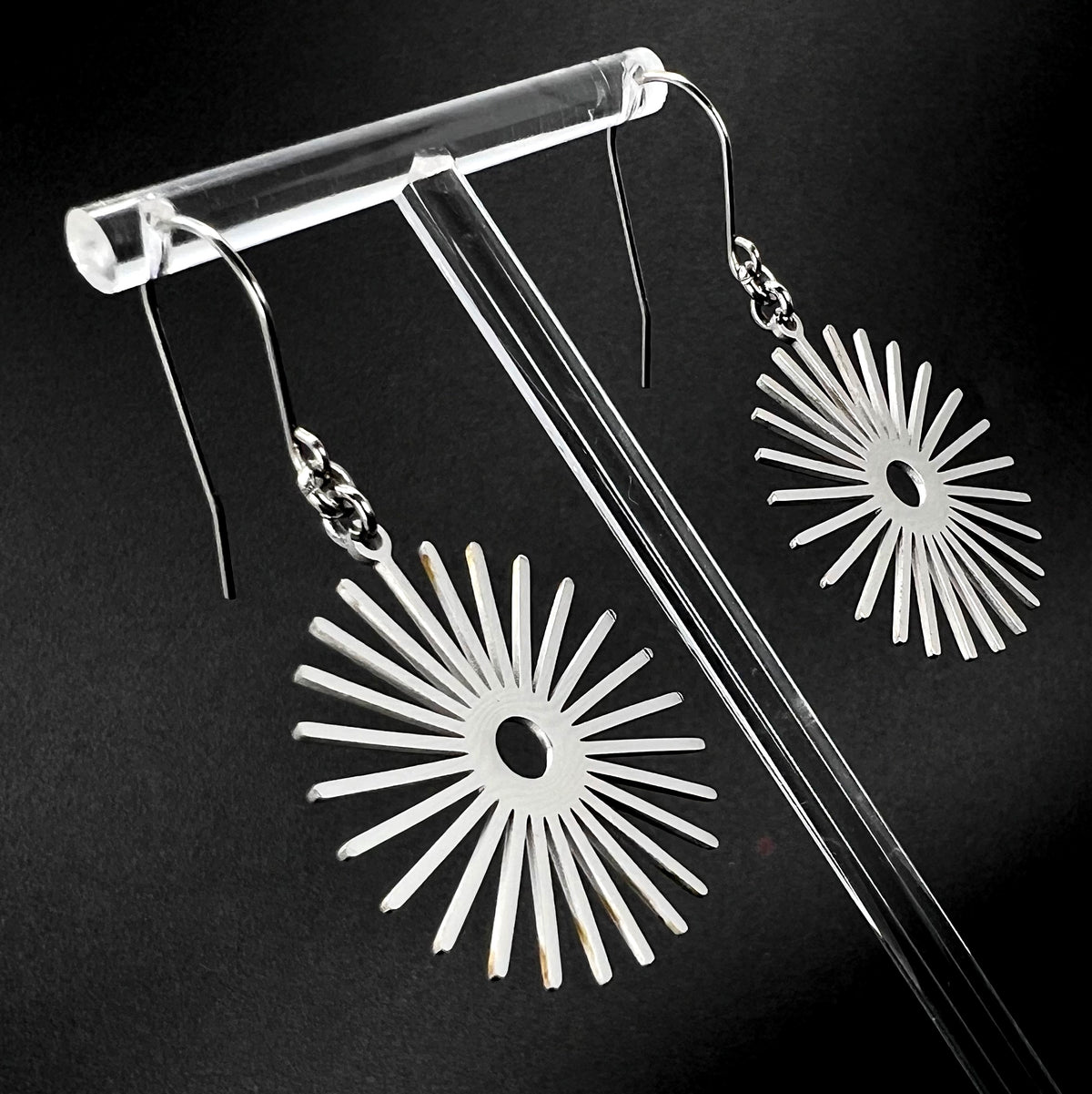 Silver stainless steel sunburst earrings with high-polish finish, 3 cm wide with a 5 cm drop — Ignia Earrings from the Eos Collection, Lawless Jewellery.