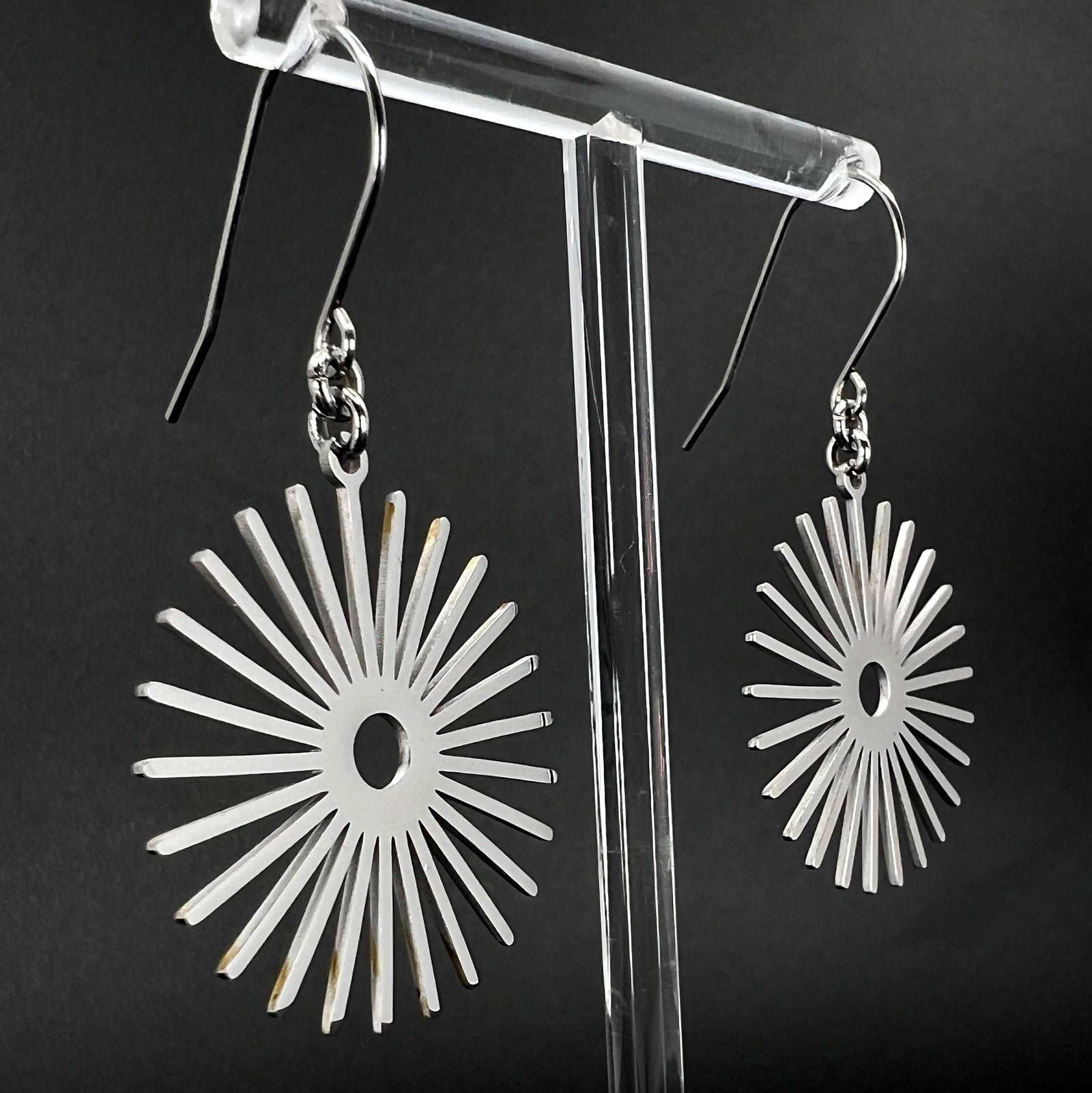 Silver stainless steel sunburst earrings with high-polish finish, 3 cm wide with a 5 cm drop — Ignia Earrings from the Eos Collection, Lawless Jewellery.