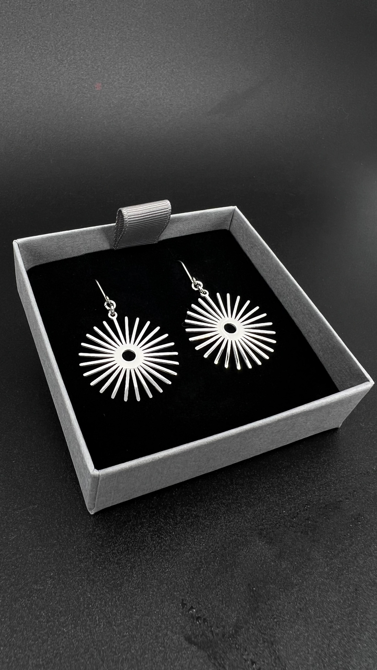 Silver stainless steel sunburst earrings with high-polish finish, 3 cm wide with a 5 cm drop — Ignia Earrings from the Eos Collection, Lawless Jewellery.