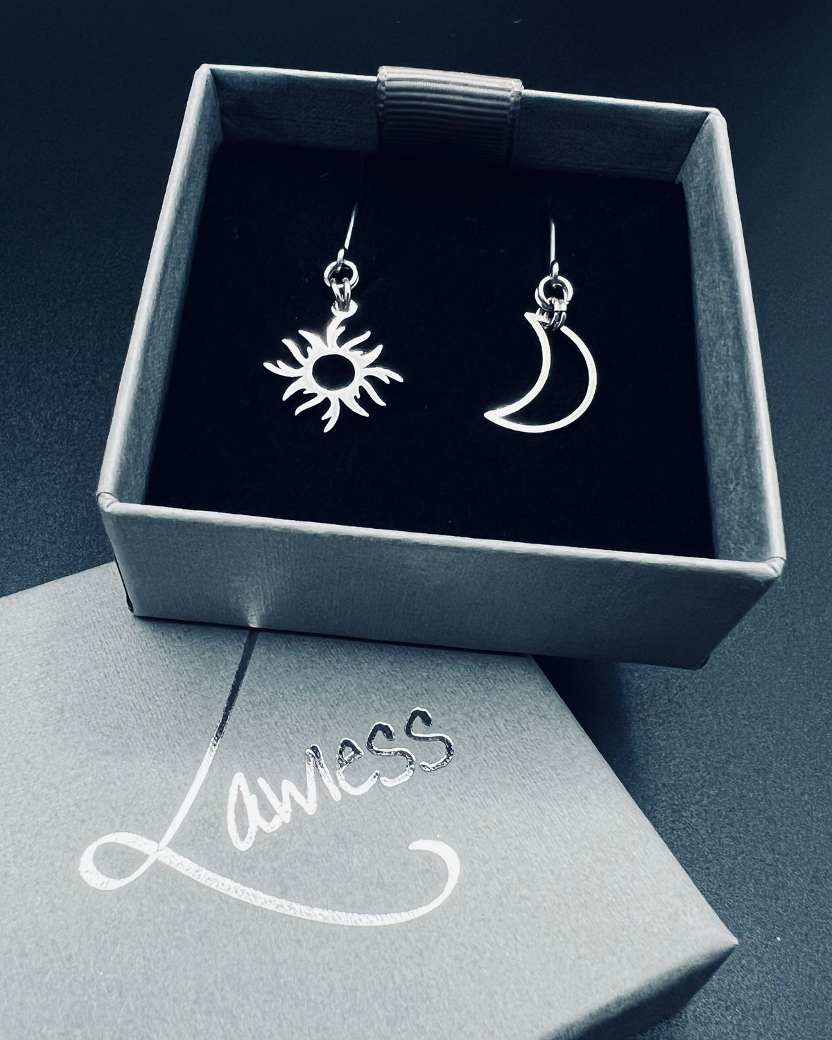 Mismatched stainless steel earrings featuring a crescent moon and radiant sun motif with a 3.5 cm drop - Eos Threshold Earrings, Lawless Jewellery