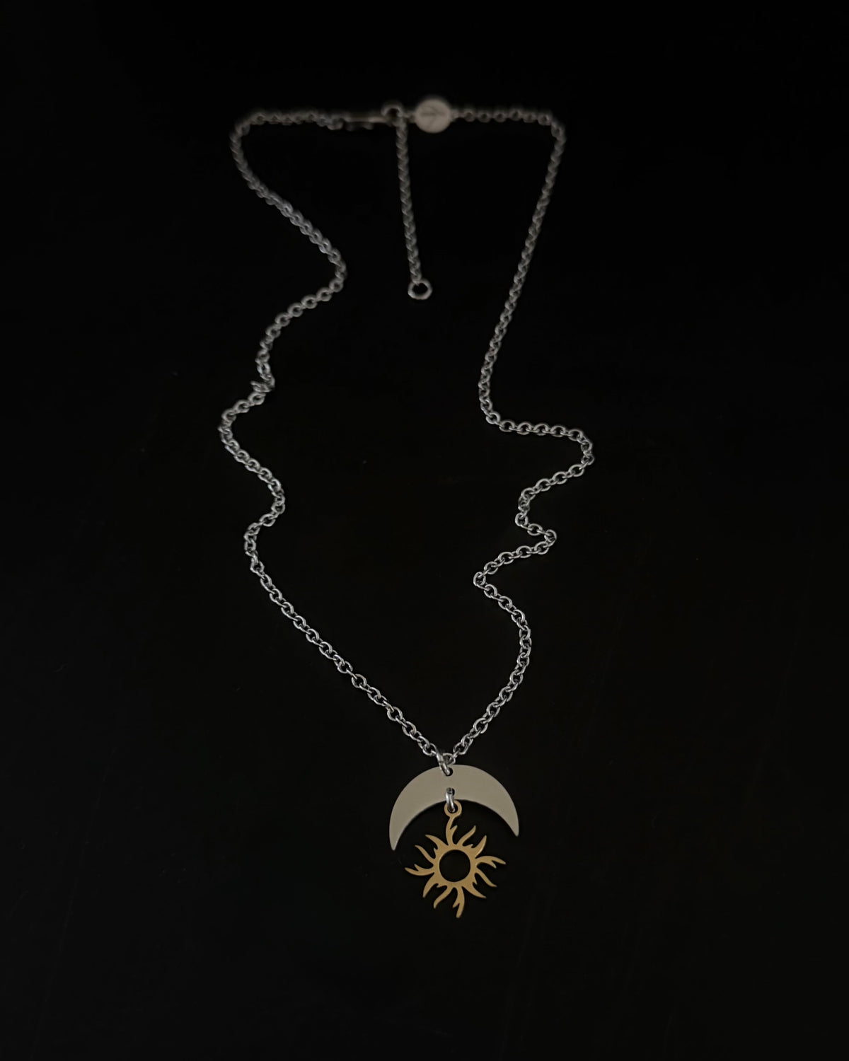 Gold plated and silver stainless steel sun and moon pendant necklace on medium weight chain, adjustable 46cm or 51cm, Lawless Jewellery.