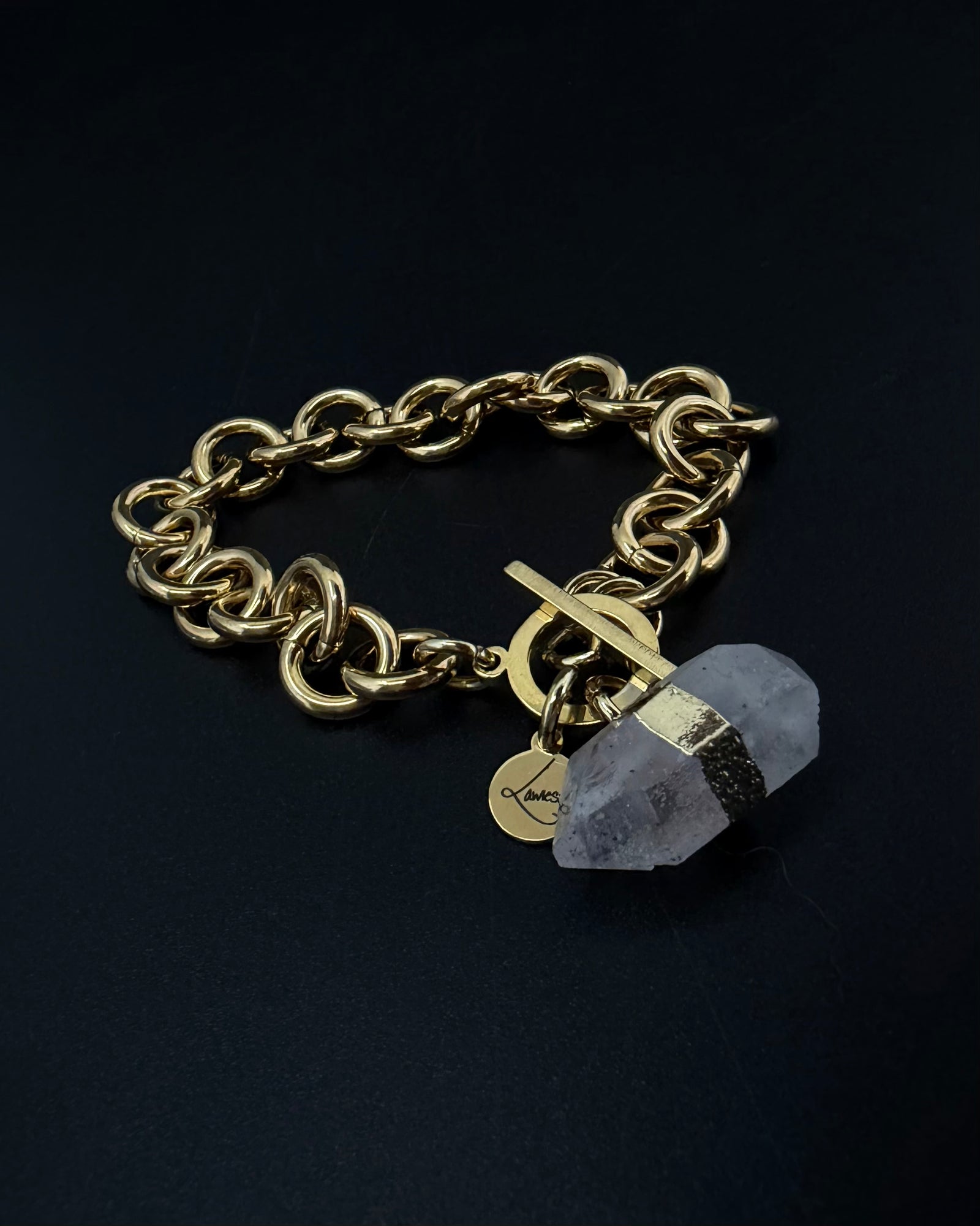 Gold-plated stainless steel chain bracelet with raw clear quartz crystal detail and toggle clasp, Athena Axiom Bracelet by Lawless Jewellery.