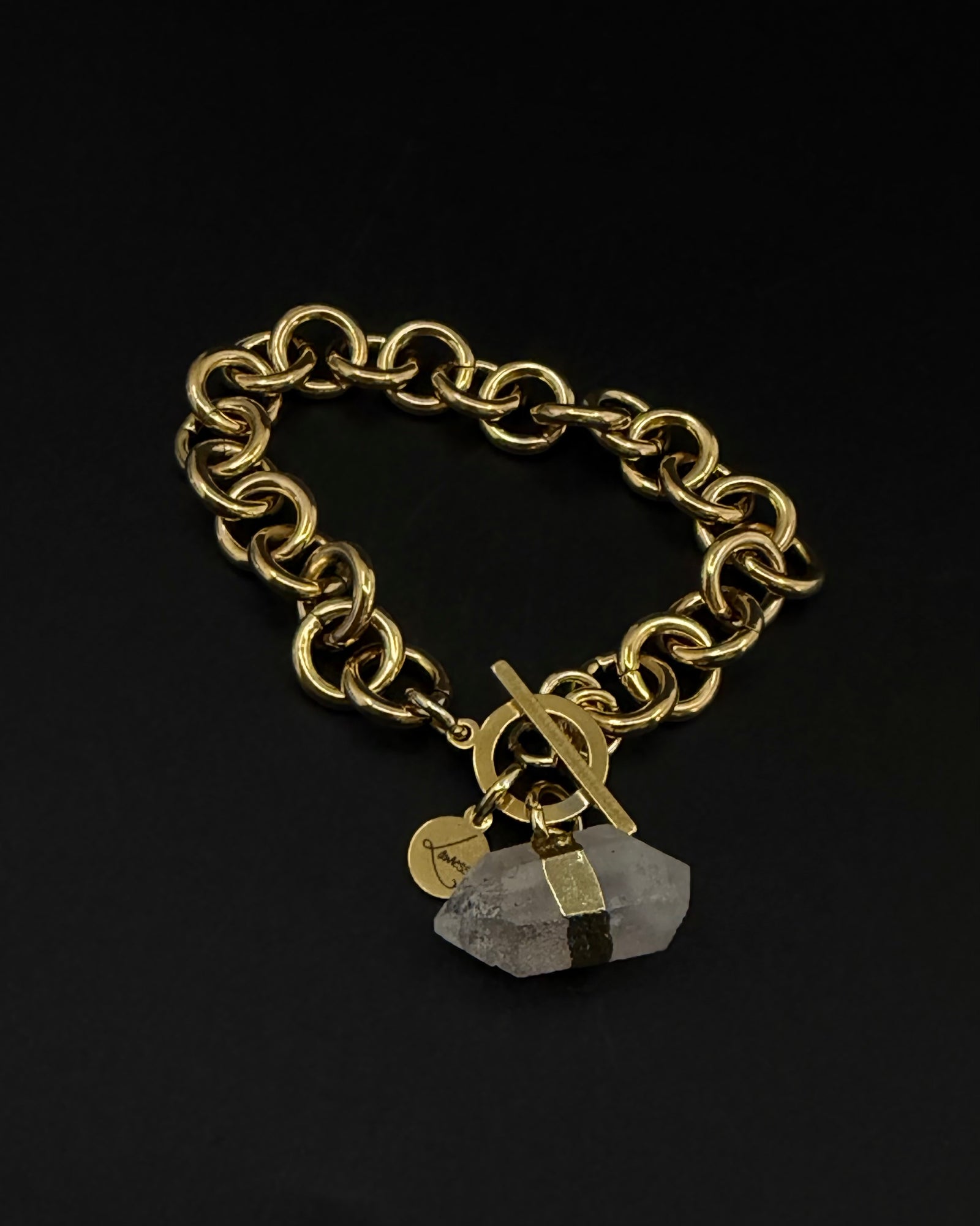 Gold-plated stainless steel chain bracelet with raw clear quartz crystal detail and toggle clasp, Athena Axiom Bracelet by Lawless Jewellery.