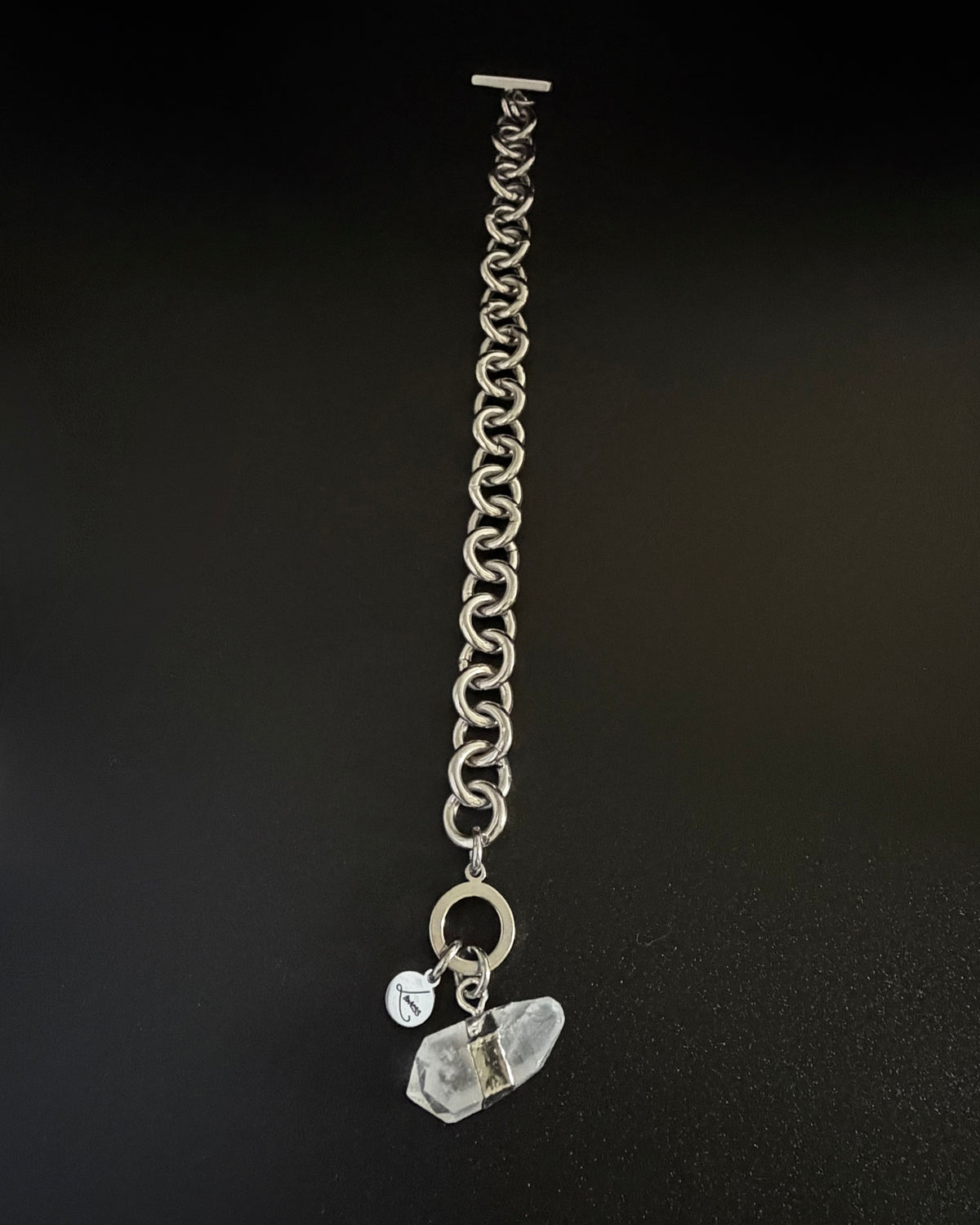 Silver stainless steel chain bracelet with raw clear quartz crystal detail and toggle clasp, Athena Axiom Bracelet by Lawless Jewellery.