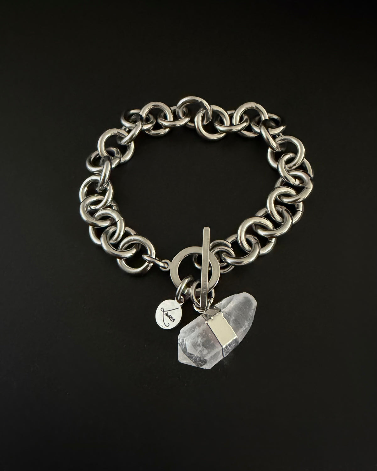 Silver stainless steel chain bracelet with raw clear quartz crystal detail and toggle clasp, Athena Axiom Bracelet by Lawless Jewellery.