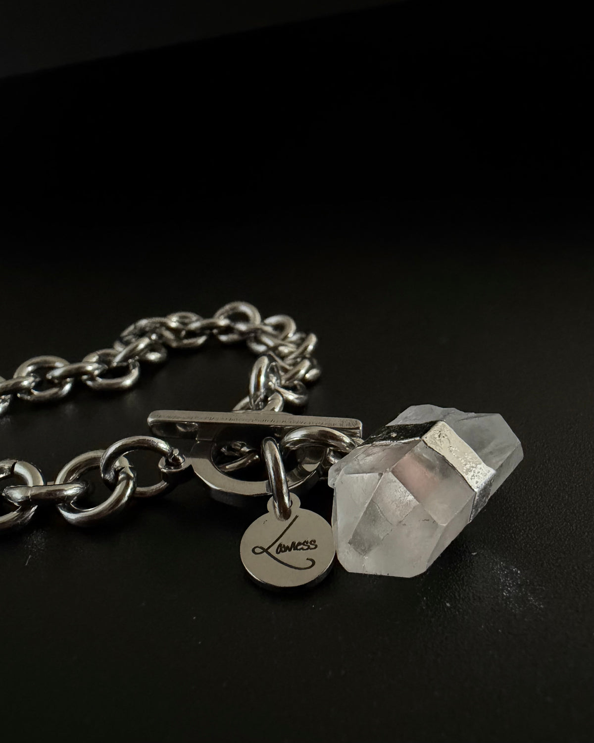 Silver stainless steel chain bracelet with raw clear quartz crystal detail on an 8 mm chain and toggle clasp, Athena Axiom Bracelet by Lawless Jewellery.