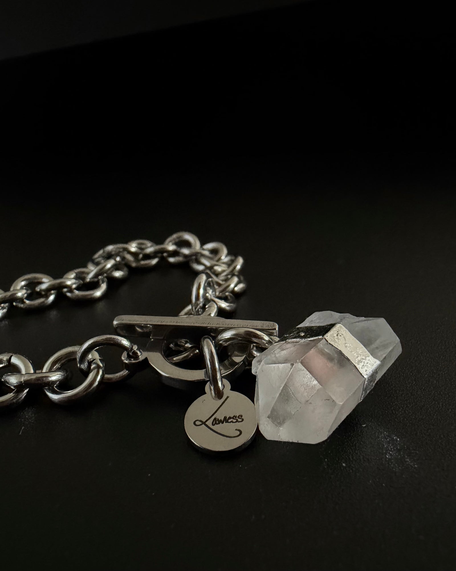 Silver stainless steel chain bracelet with raw clear quartz crystal detail on an 8 mm chain and toggle clasp, Athena Axiom Bracelet by Lawless Jewellery.