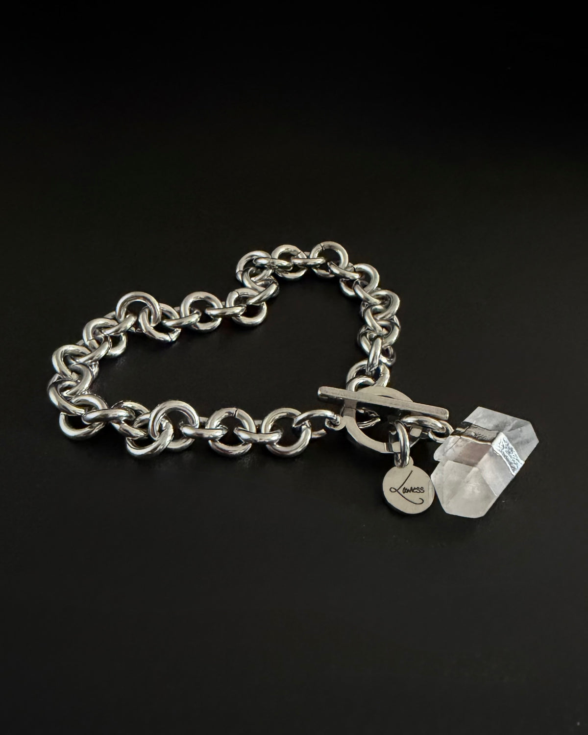 Silver stainless steel chain bracelet with raw clear quartz crystal detail on an 8 mm chain and toggle clasp, Athena Axiom Bracelet by Lawless Jewellery.