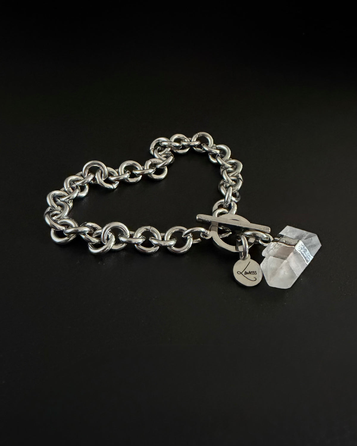 Silver stainless steel chain bracelet with raw clear quartz crystal detail on an 8 mm chain and toggle clasp, Athena Axiom Bracelet by Lawless Jewellery.