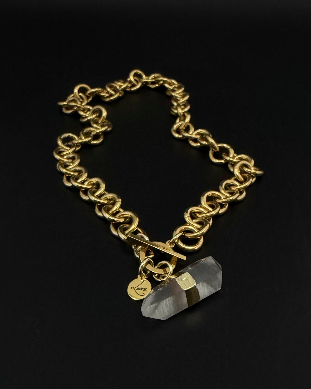 Gold-plated stainless steel chain necklace with raw clear quartz crystal pendant and toggle clasp, Athena Axiom Necklace by Lawless Jewellery.