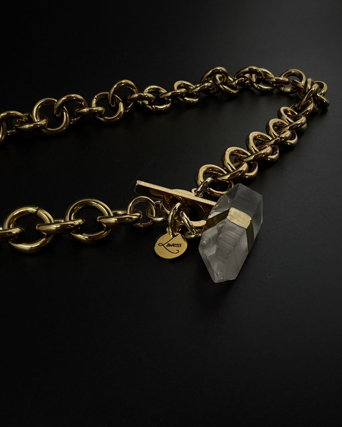 Gold-plated stainless steel chain necklace with raw clear quartz crystal pendant and toggle clasp, Athena Axiom Necklace by Lawless Jewellery.