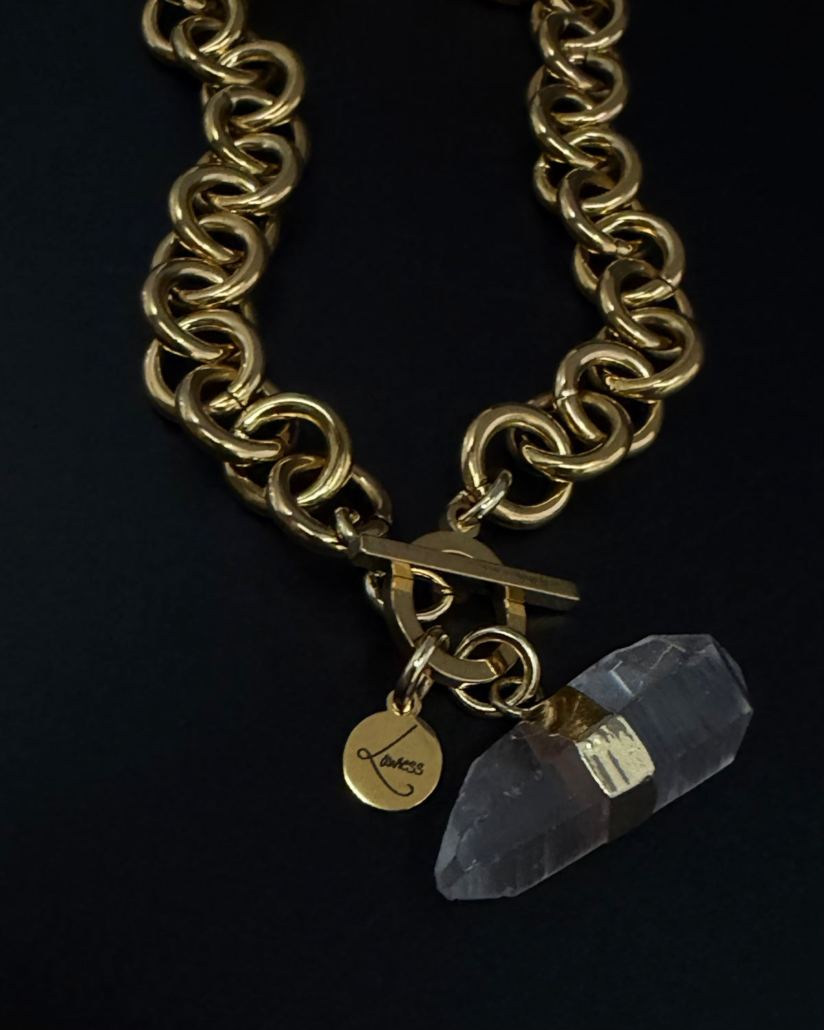 Gold-plated stainless steel chain necklace with raw clear quartz crystal pendant and toggle clasp, Athena Axiom Necklace by Lawless Jewellery.