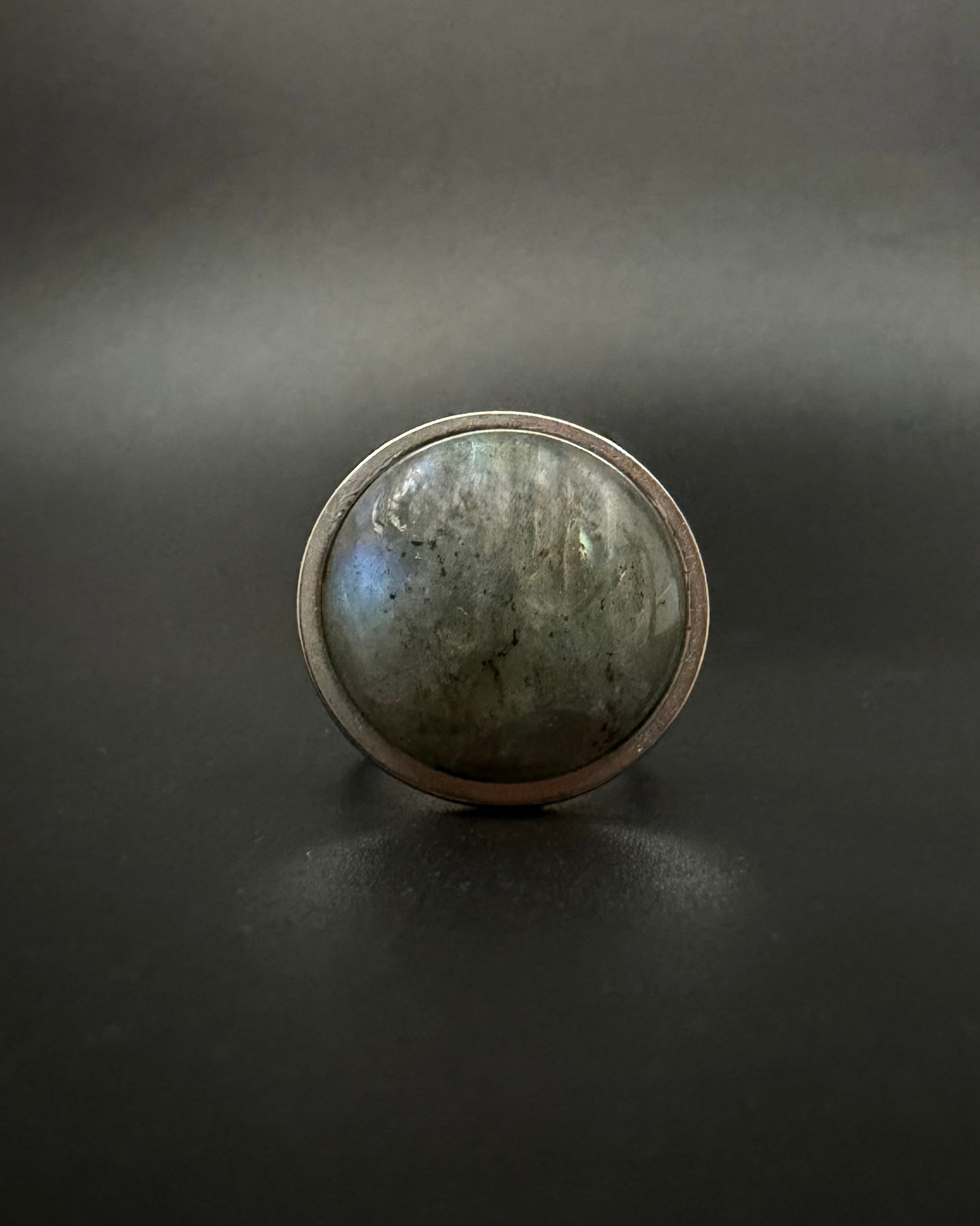 Silver adjustable double-shank ring with large 20 mm domed labradorite gemstone showing blue and grey flashes, Nebulae Core Ring by Lawless Jewellery.