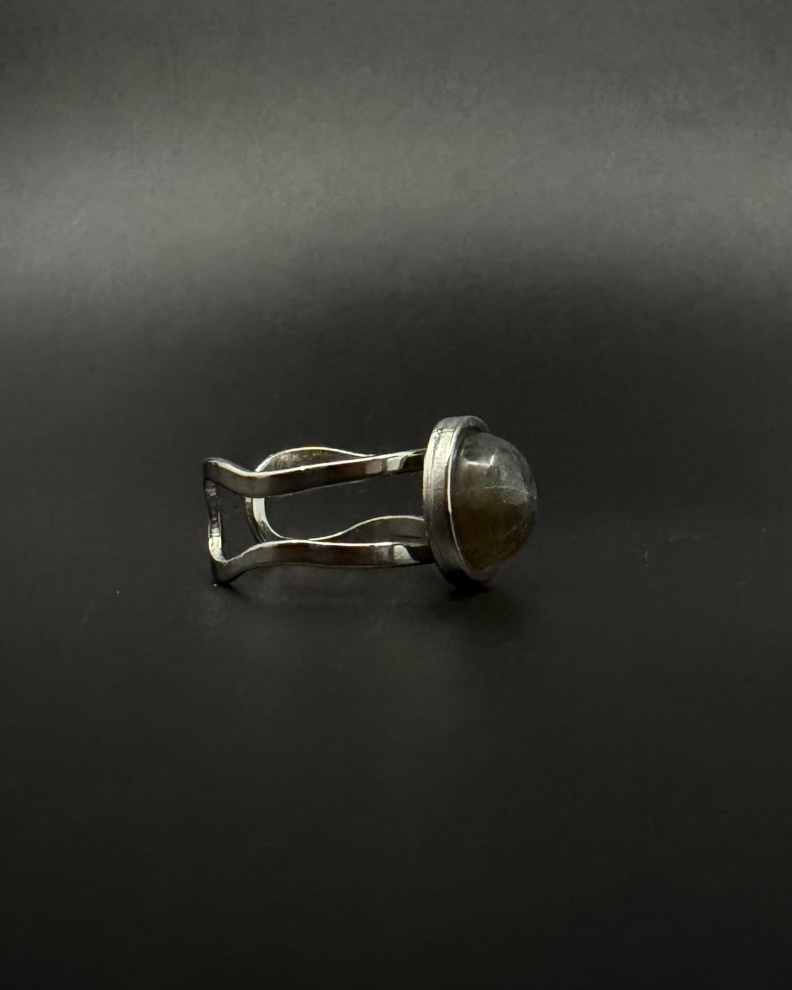Silver adjustable double-shank ring with domed 10 mm labradorite gemstone showing blue and grey flashes, Nebulae Core Ring by Lawless Jewellery