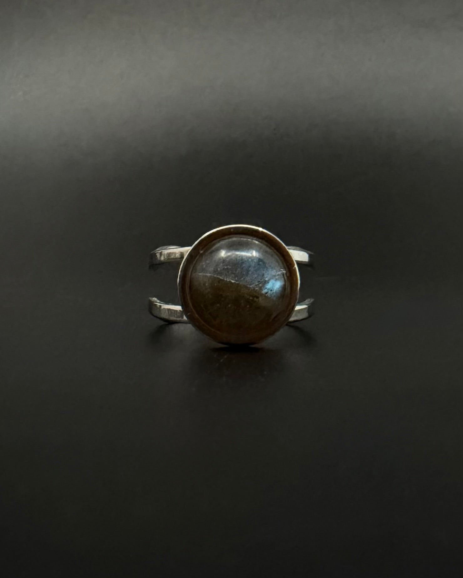 Silver adjustable double-shank ring with domed 10 mm labradorite gemstone showing blue and grey flashes, Nebulae Core Ring by Lawless Jewellery