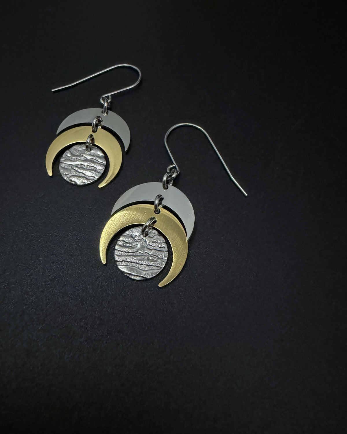Silver and gold Luna Phase earrings with crescent moon design and textured gold lunar disc, lightweight stainless steel
