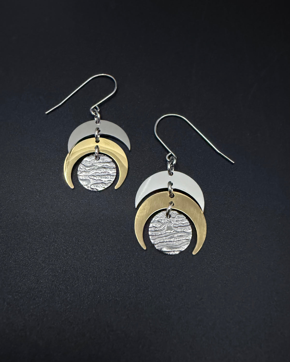 Silver and gold Luna Phase earrings with crescent moon design and textured gold lunar disc, lightweight stainless steel