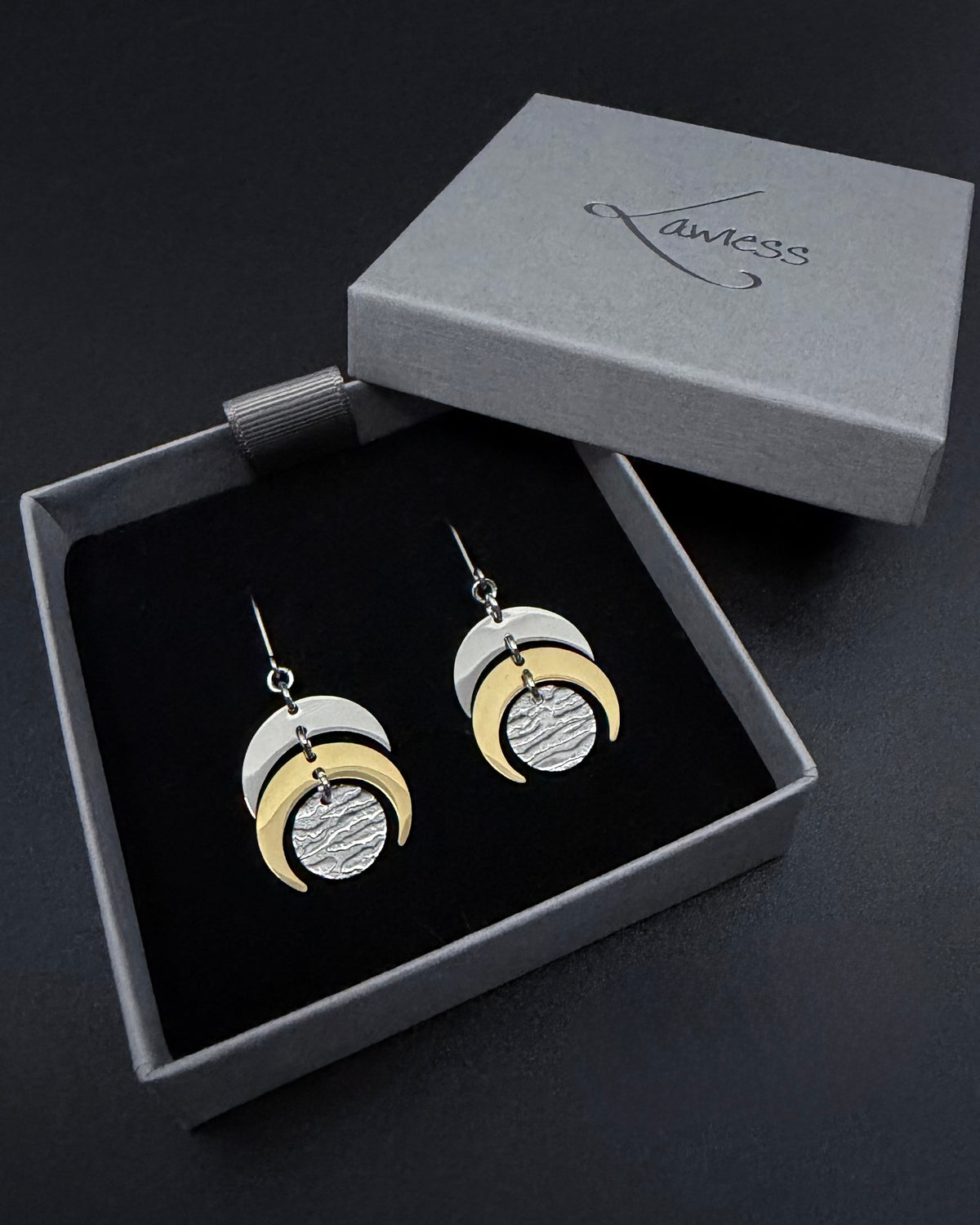 Silver and gold Luna Phase earrings with crescent moon design and textured gold lunar disc, lightweight stainless steel