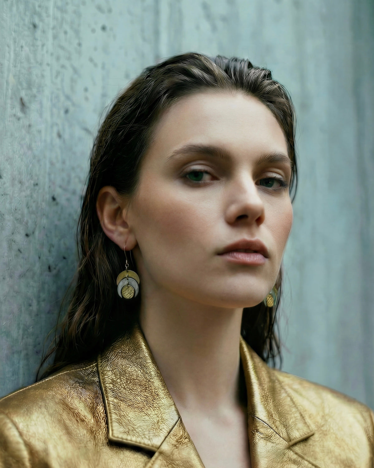 Mixed metal Luna Phase Earrings in gold and silver with sculptural crescent design and textured gold disc, 20mm width, stainless steel.