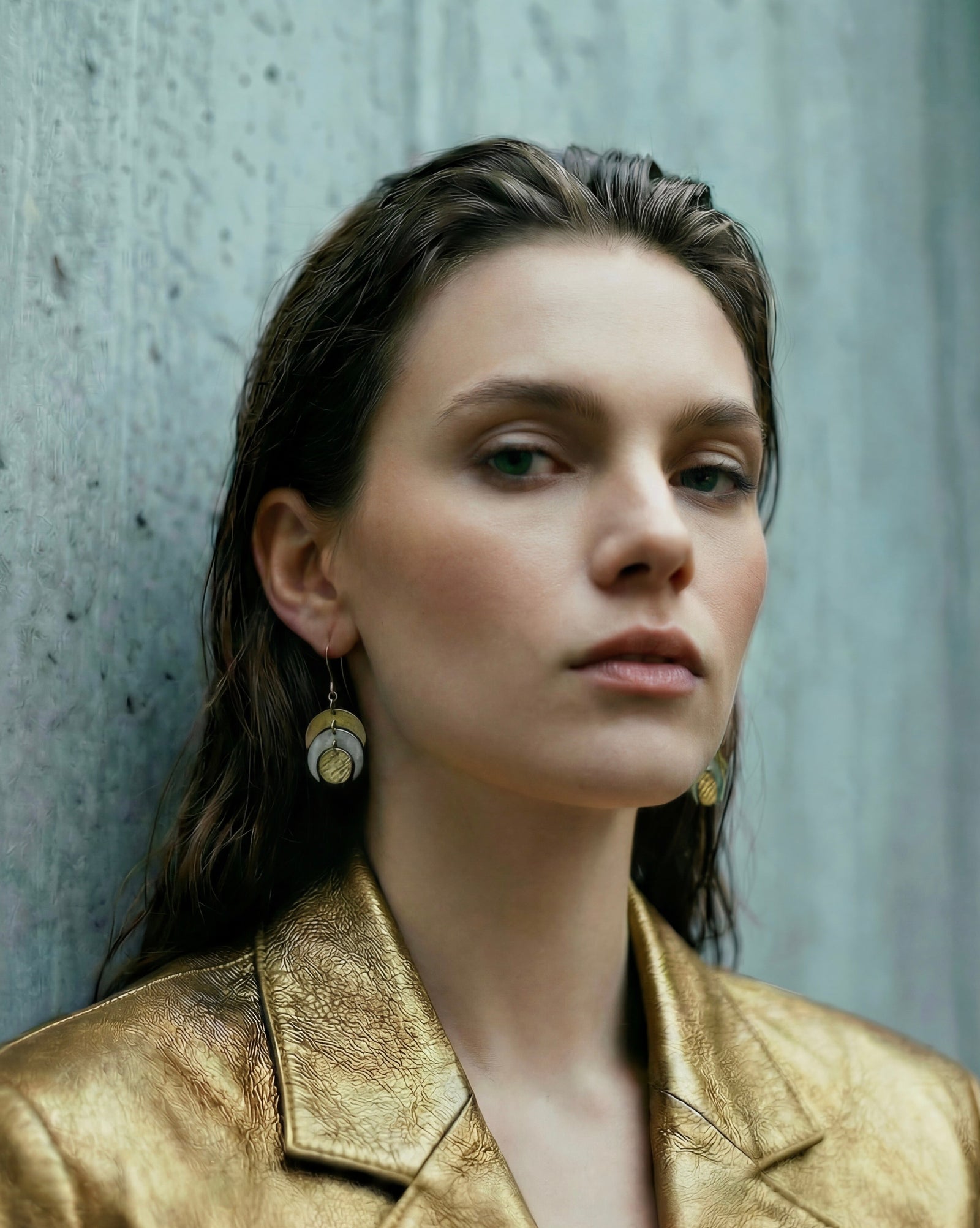 Mixed metal Luna Phase Earrings in gold and silver with sculptural crescent design and textured gold disc, 20mm width, stainless steel.