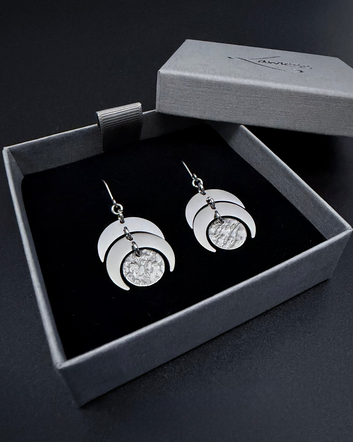 Silver Luna Phase Earrings with polished stainless-steel crescents and textured central disc, 20 mm wide and 4 cm long — Lawless Jewellery