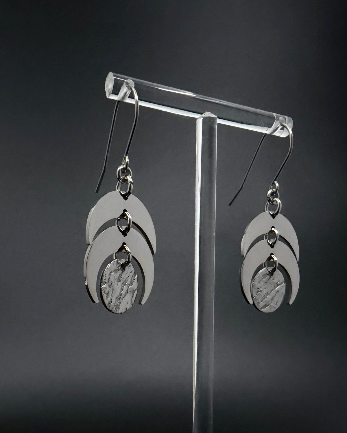 Silver Luna Phase Earrings with polished stainless-steel crescents and textured central disc, 20 mm wide and 4 cm long — Lawless Jewellery