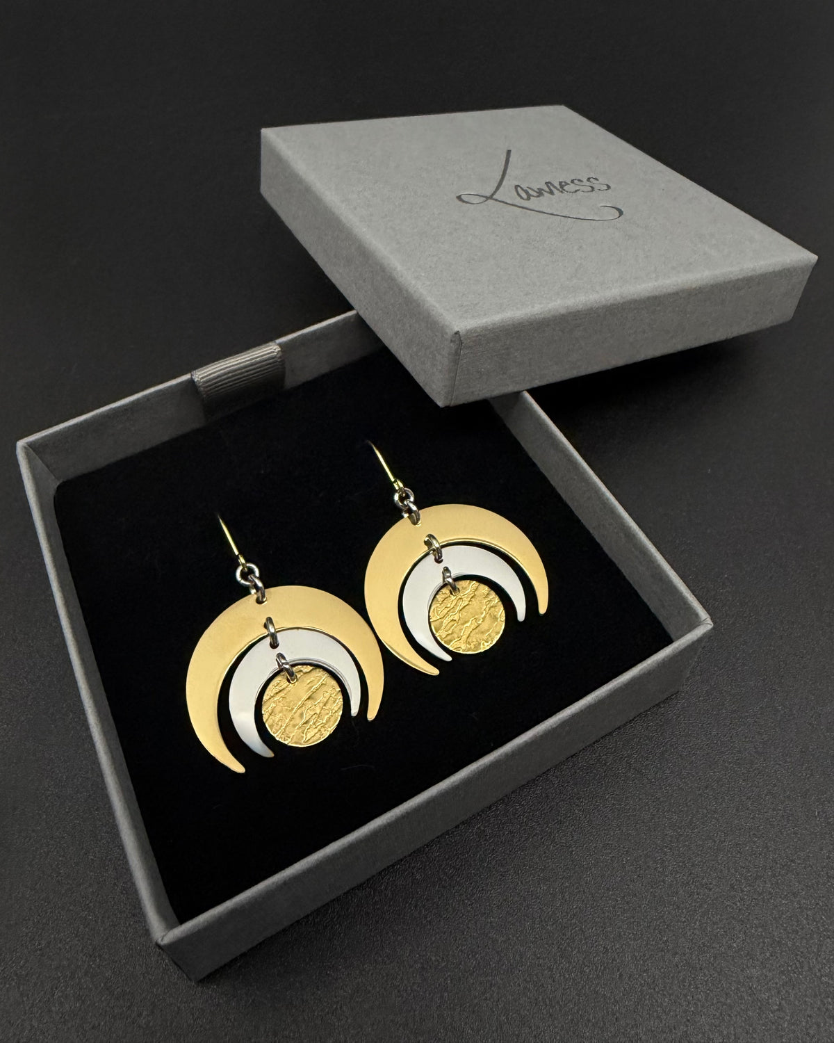 Gold and silver stainless steel Luna Phase Earrings with triple crescent design and textured central disc, 30mm width