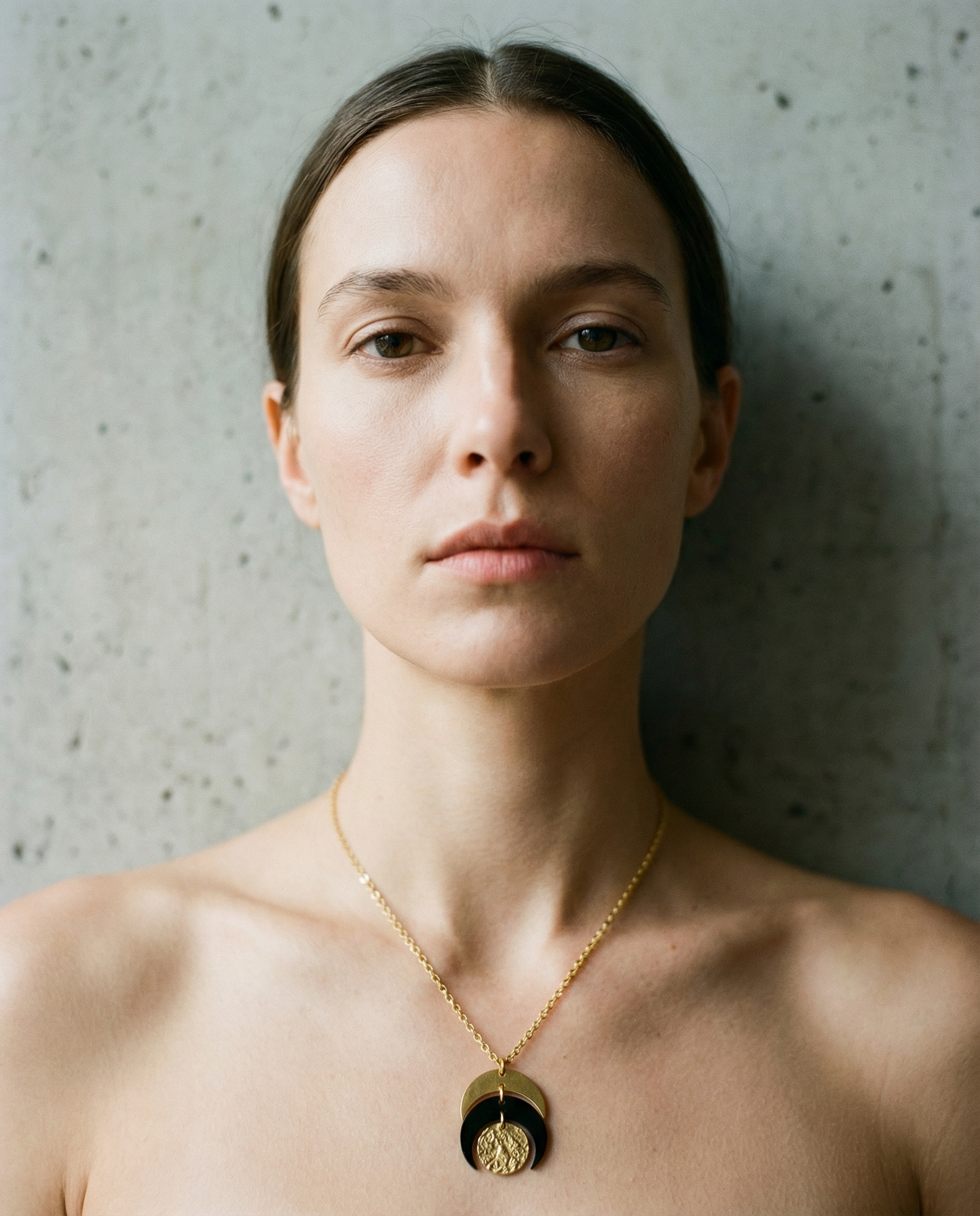 Gold and black stainless steel Luna Phase 20mm Necklace with sculptural crescent pendant and adjustable chain — Lawless Jewellery.