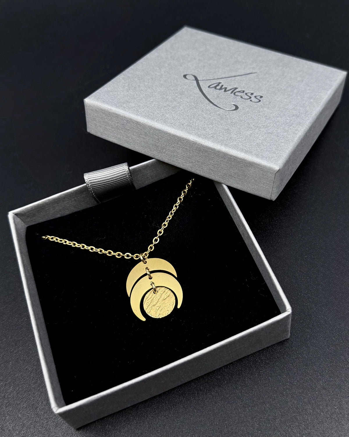 Gold Luna Phase Necklace with 20mm crescent moon pendant and textured disc on adjustable gold-tone stainless steel chain