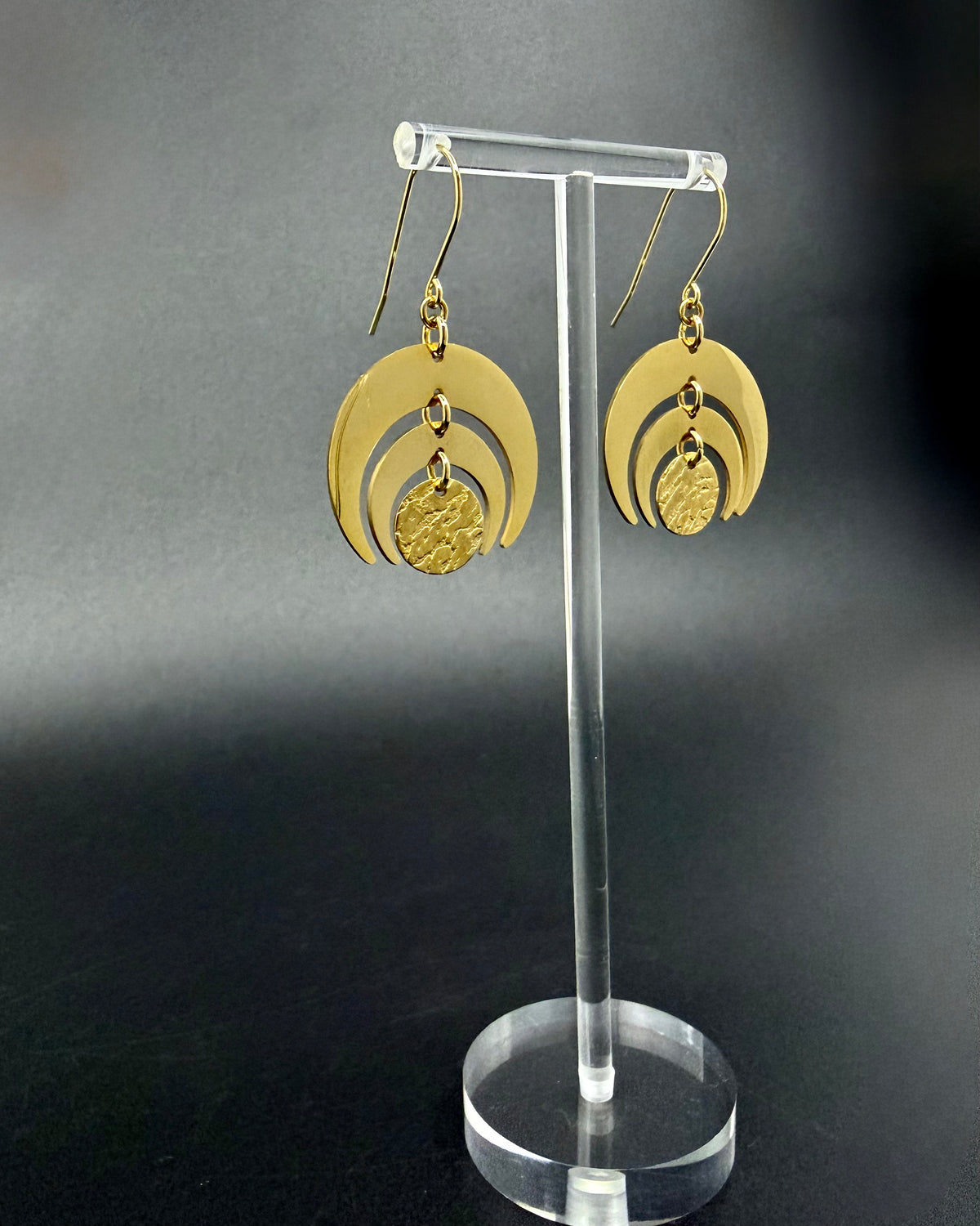 All gold Luna Phase Earrings in gold-plated stainless steel with triple crescent design and textured central disc, 30mm width.
