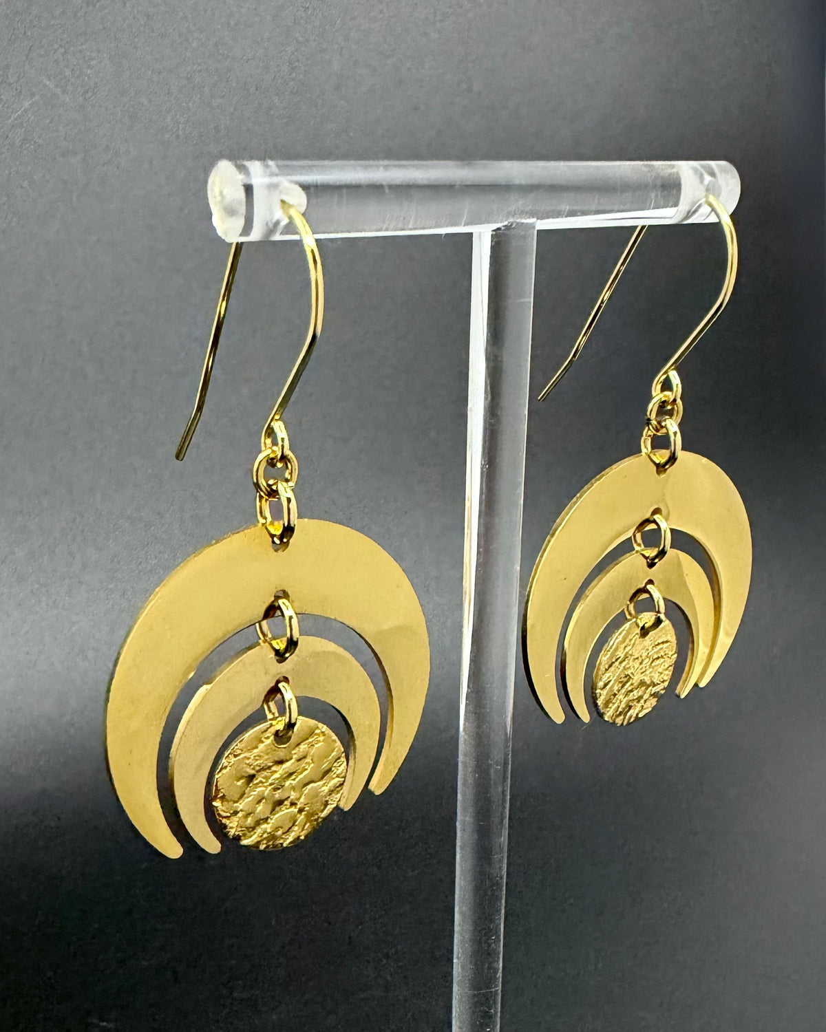 All gold Luna Phase Earrings in gold-plated stainless steel with triple crescent design and textured central disc, 30mm width.