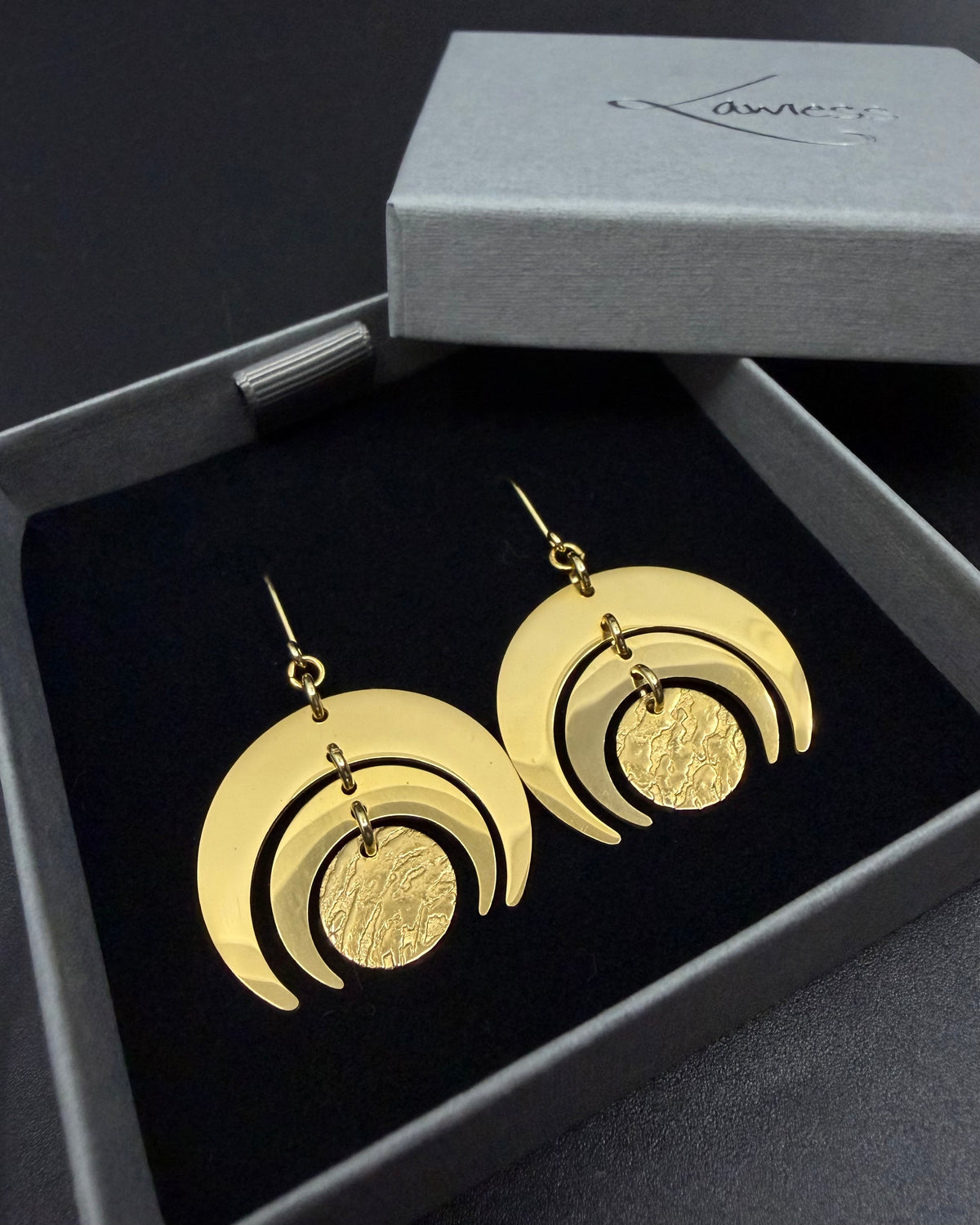 All gold Luna Phase Earrings in gold-plated stainless steel with triple crescent design and textured central disc, 30mm width.