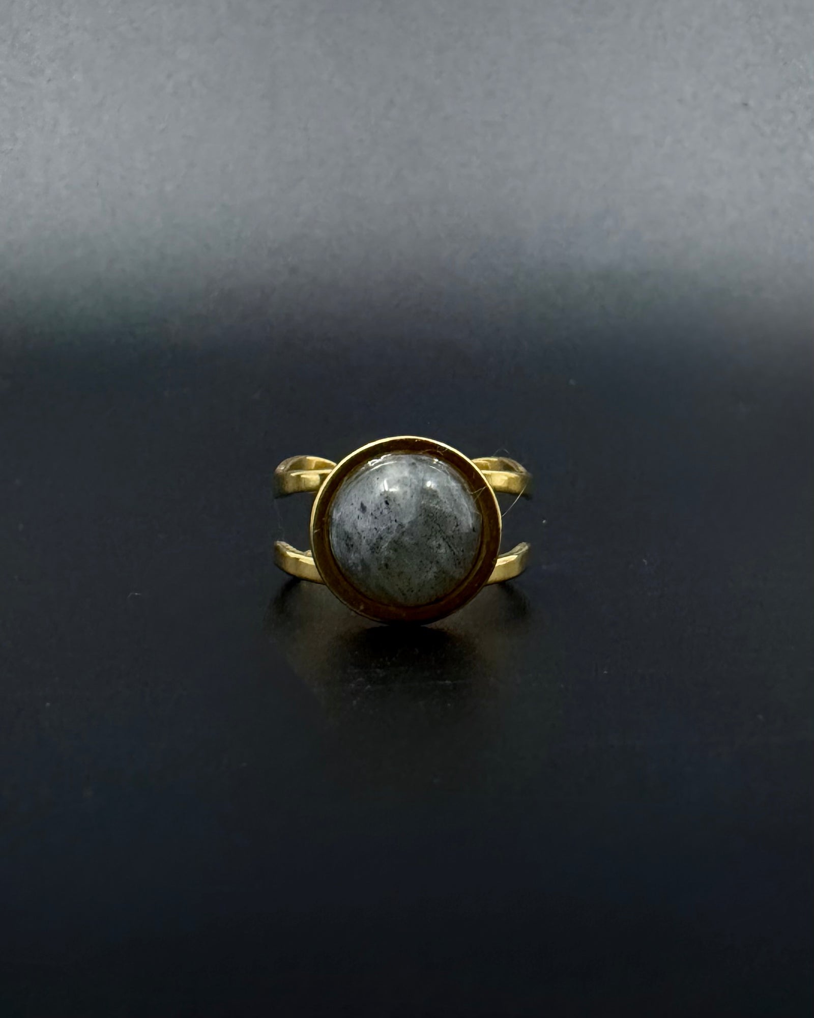 Gold adjustable statement ring with 10mm domed labradorite gemstone showing blue-grey iridescence, double-shank stainless steel band, Nebulae Core Ring by Lawless Jewellery