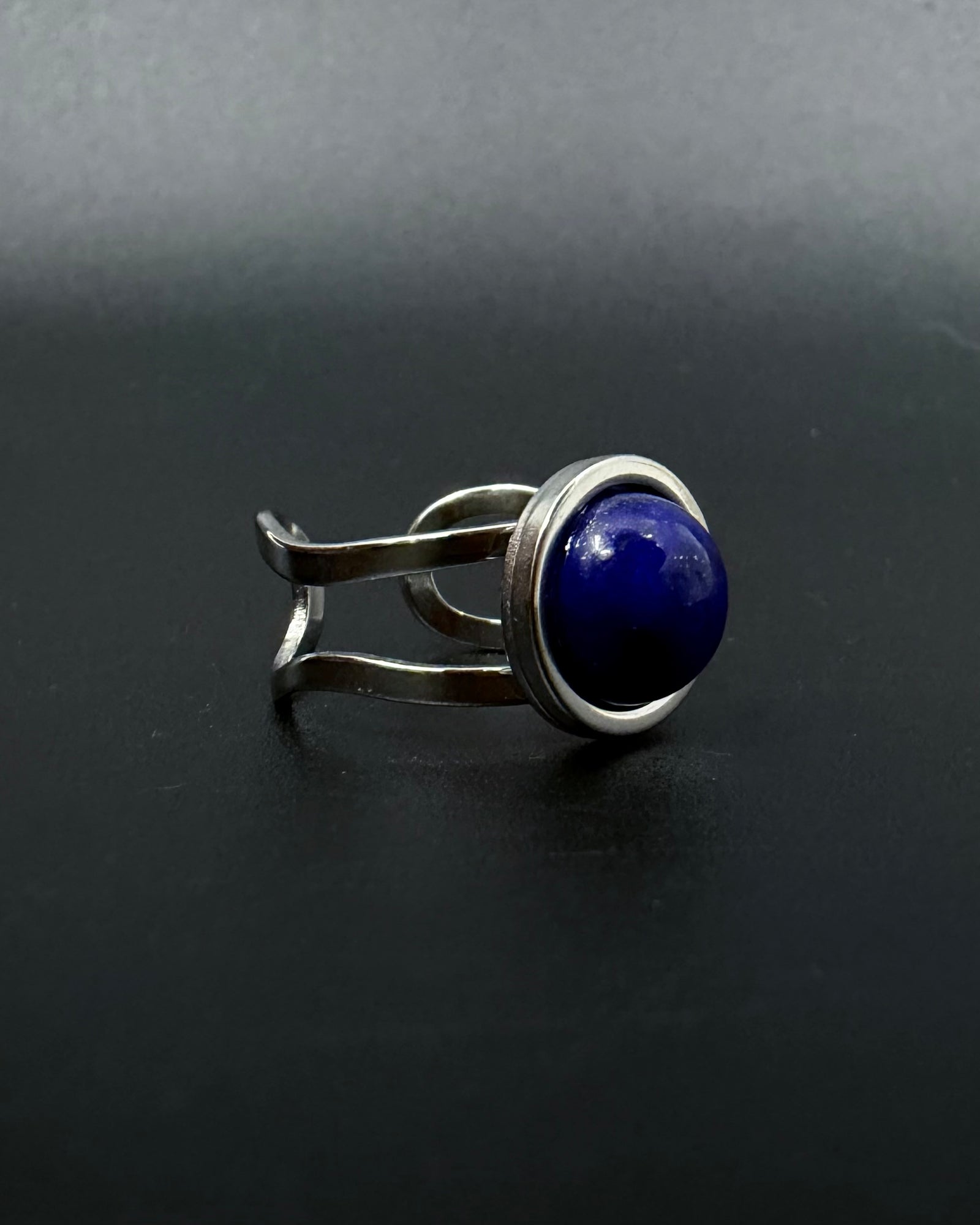 Silver adjustable statement ring with 10mm domed lapis lazuli gemstone featuring natural gold flecks, double-shank stainless steel band, Nebulae Core Ring by Lawless Jewellery