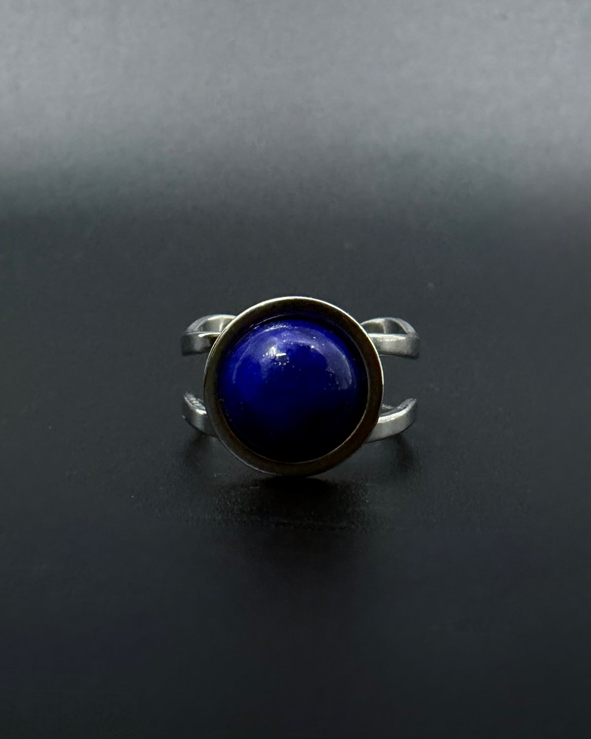 Silver adjustable statement ring with 10mm domed lapis lazuli gemstone featuring natural gold flecks, double-shank stainless steel band, Nebulae Core Ring by Lawless Jewellery