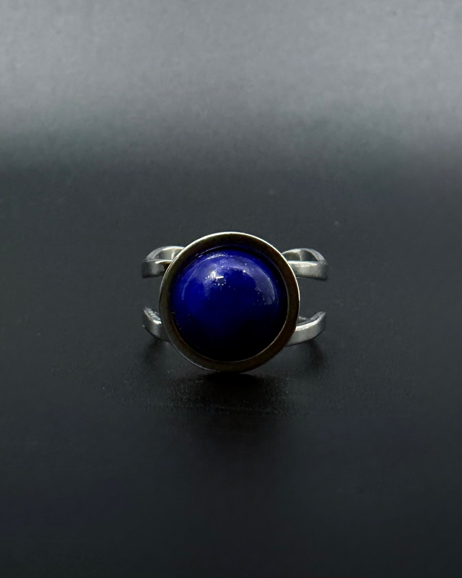 Silver adjustable statement ring with 10mm domed lapis lazuli gemstone featuring natural gold flecks, double-shank stainless steel band, Nebulae Core Ring by Lawless Jewellery