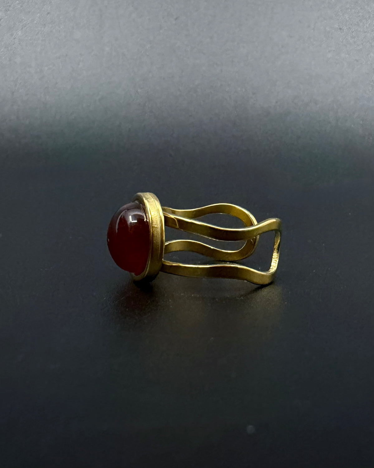 Gold adjustable statement ring with 10mm domed carnelian gemstone, double-shank stainless steel band, Nebulae Core Ring by Lawless Jewellery
