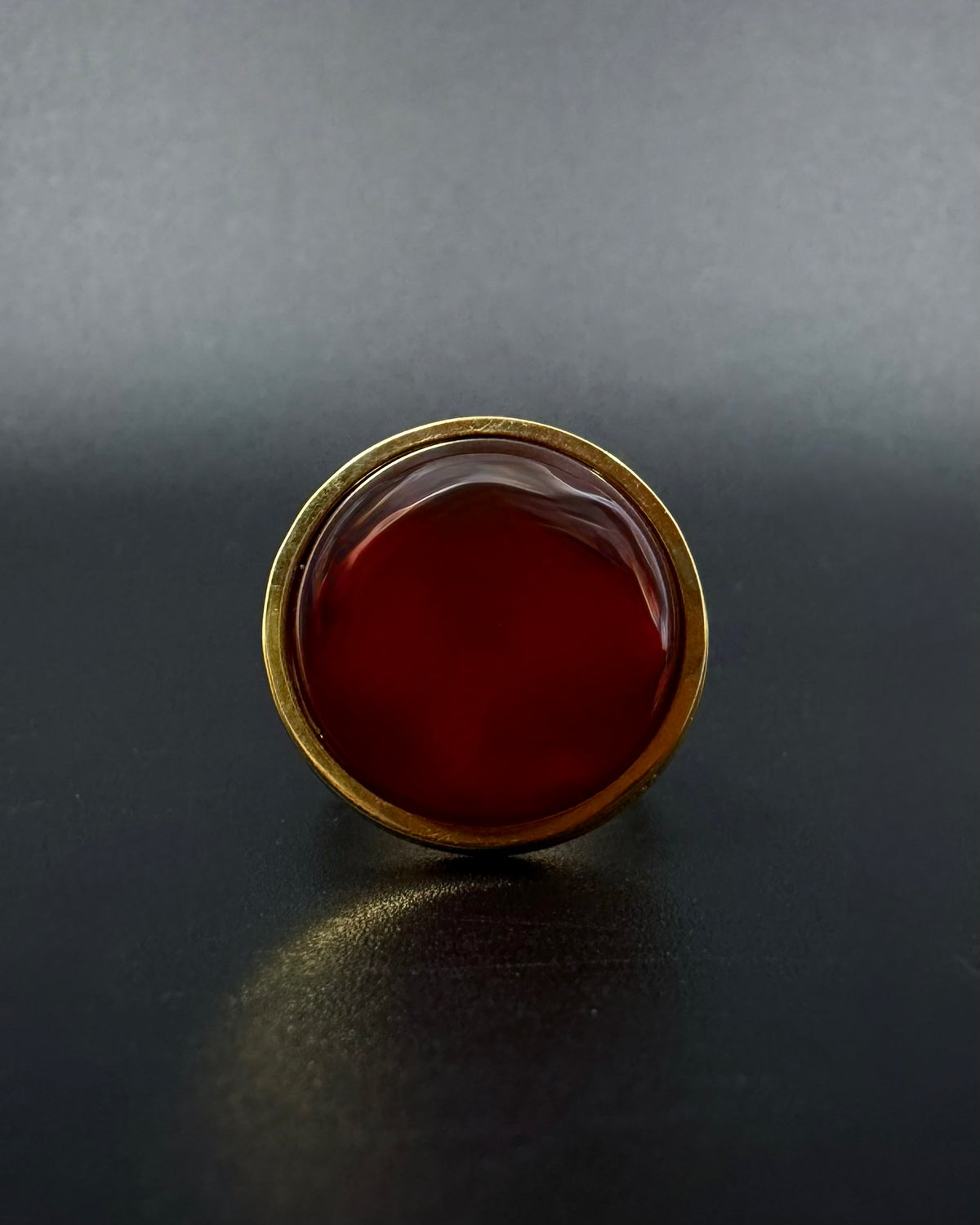 Gold adjustable statement ring with 20mm domed carnelian gemstone, double-shank stainless steel band, Nebulae Core Ring by Lawless Jewellery