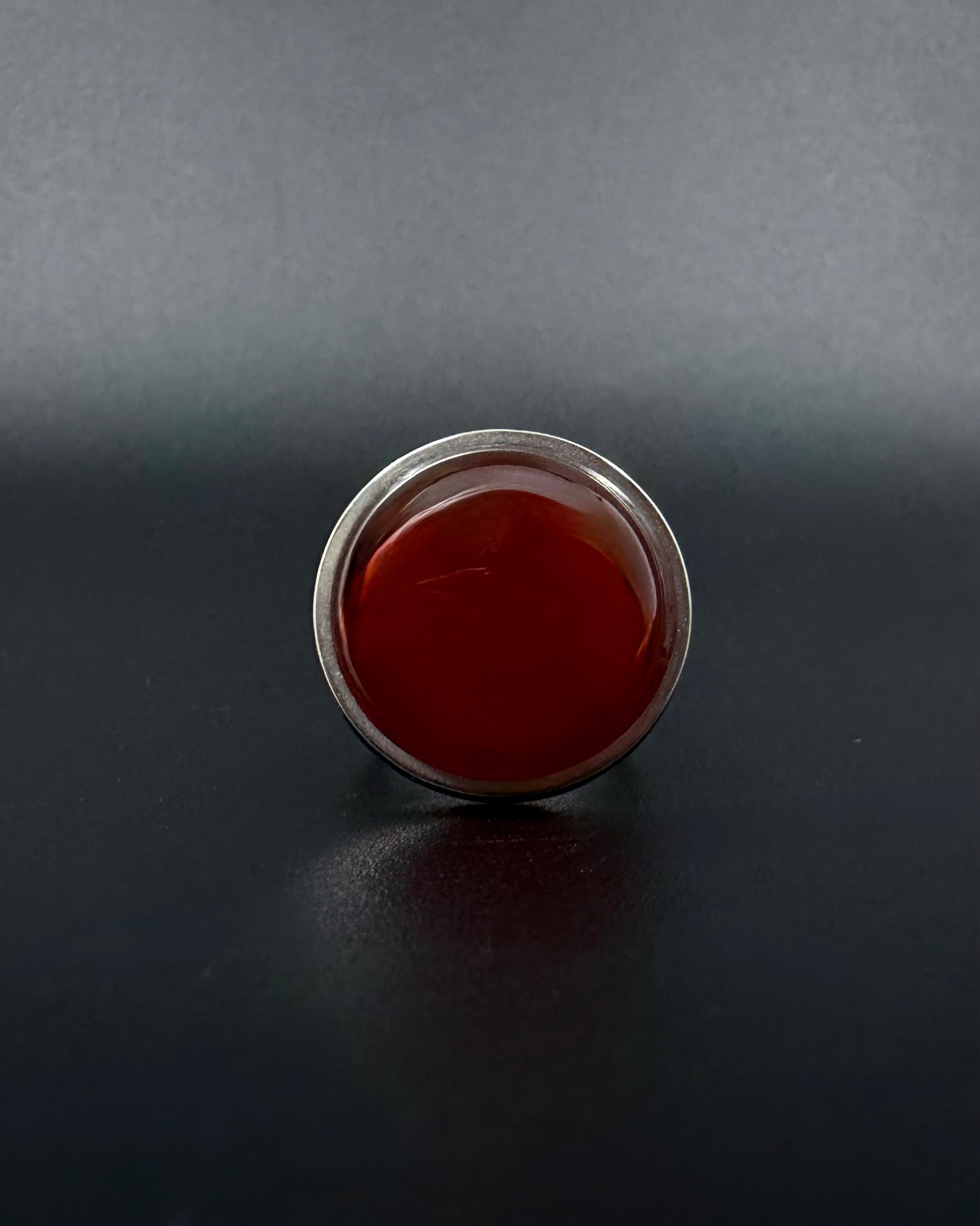 Silver adjustable statement ring with 20mm domed carnelian gemstone, double-shank stainless steel band, Nebulae Core Ring by Lawless Jewellery